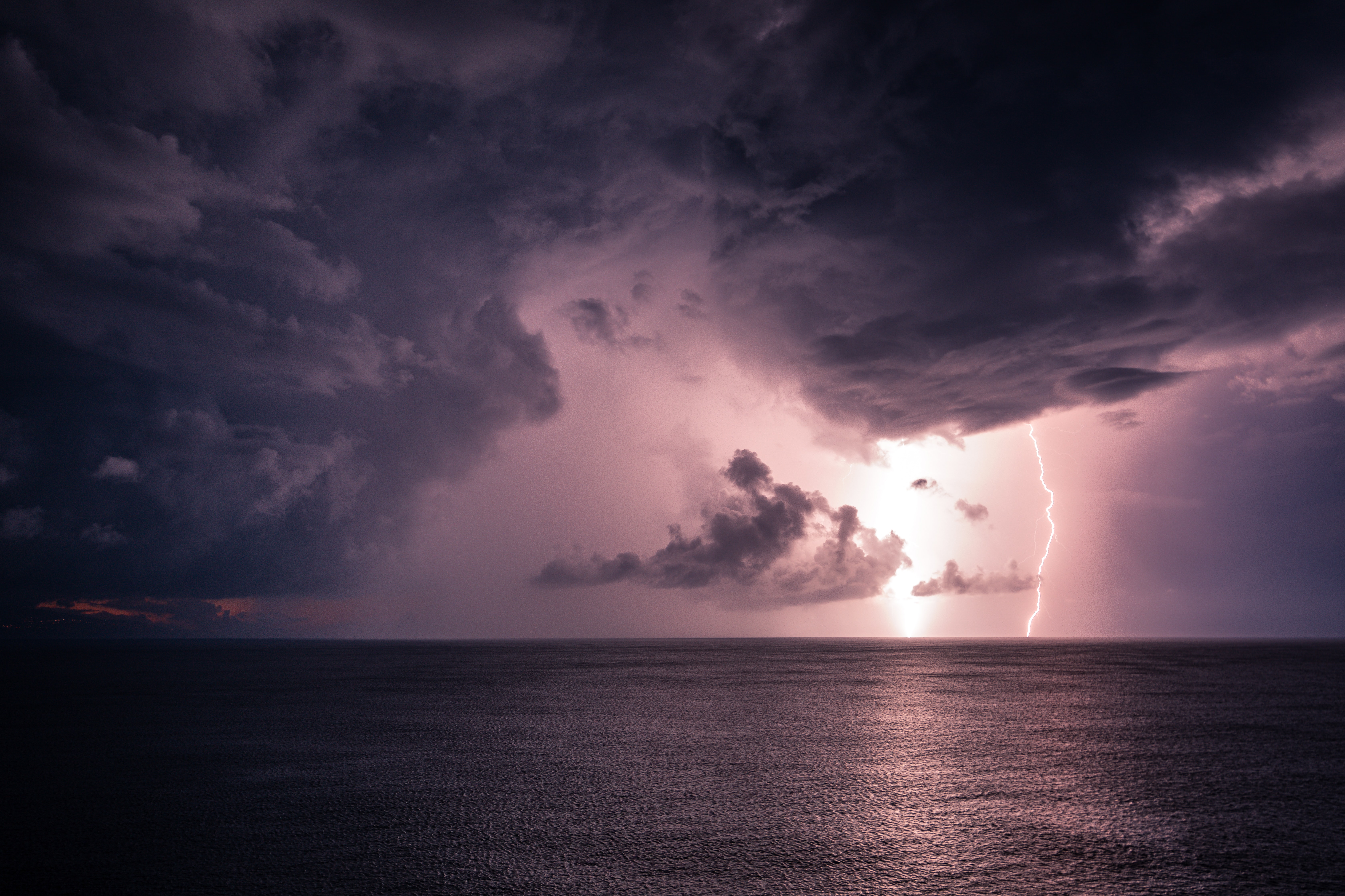 Download mobile wallpaper Clouds, Horizon, Sea, Glare, Nature, Lightning for free.