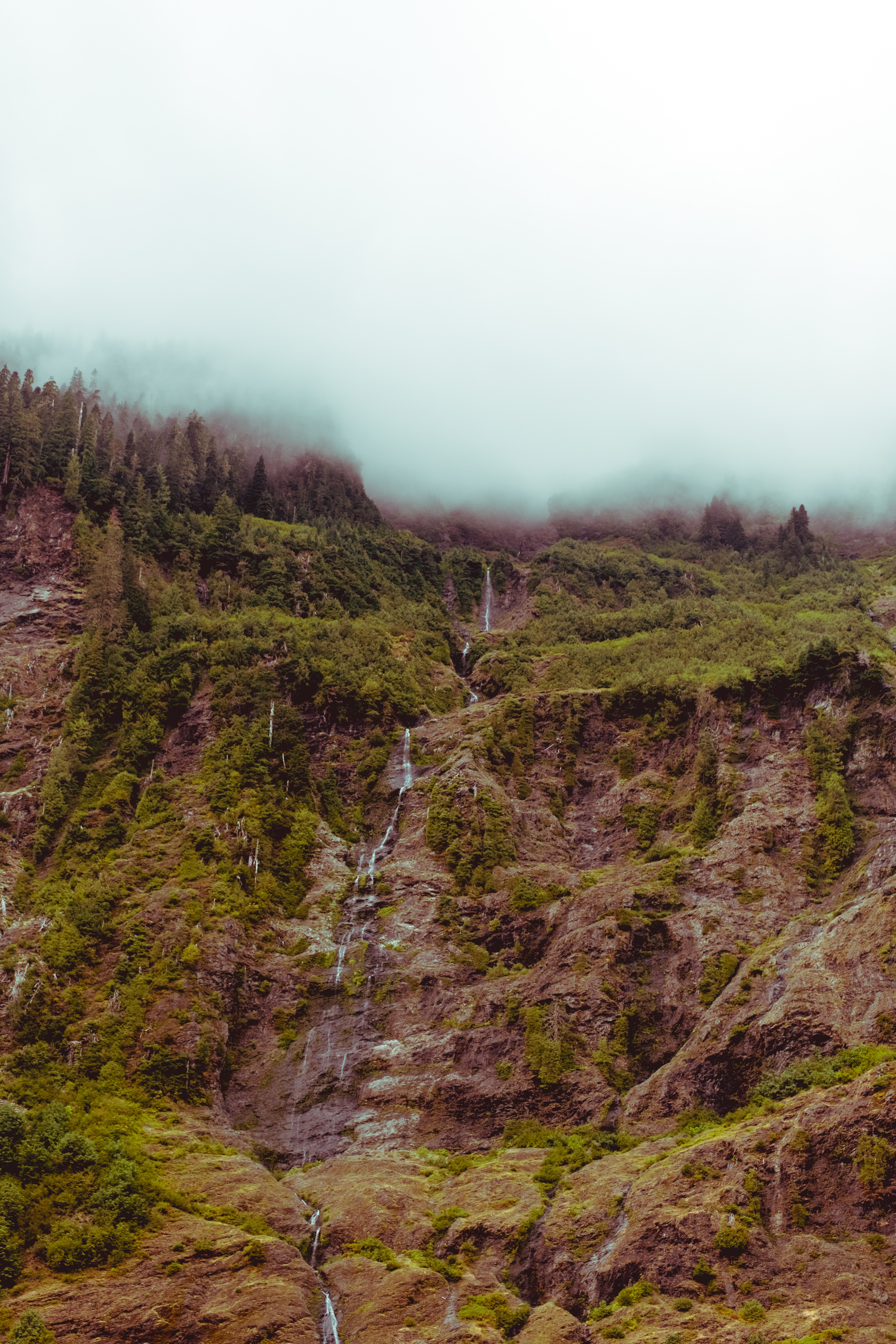 Download mobile wallpaper Fog, Break, Precipice, Waterfall, Mountain, Sky, Nature for free.