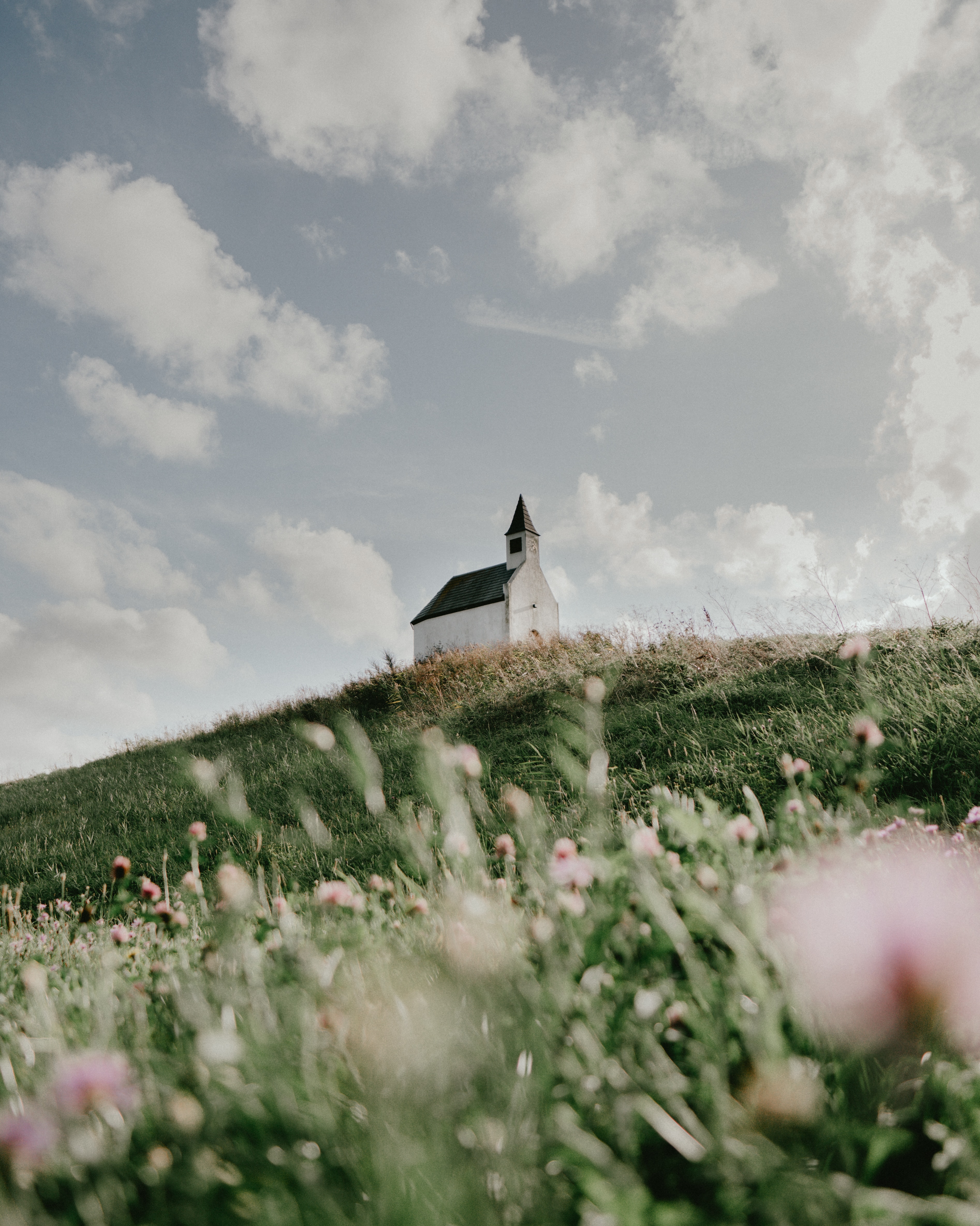 Free download wallpaper Grass, Building, Hill, Flowers, Nature, Church on your PC desktop
