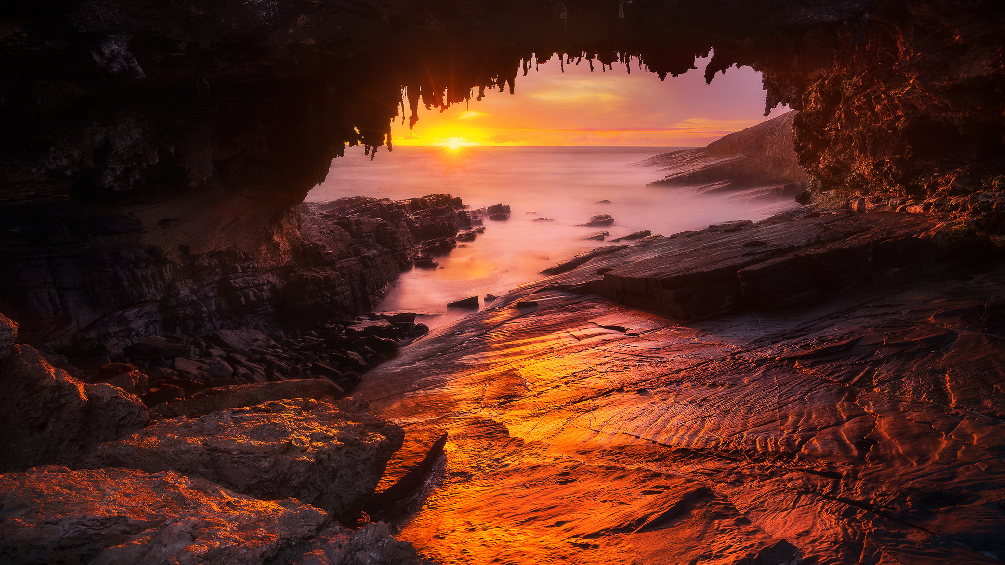 Download mobile wallpaper Sunset, Sea, Beach, Caves, Horizon, Ocean, Earth, Cave for free.