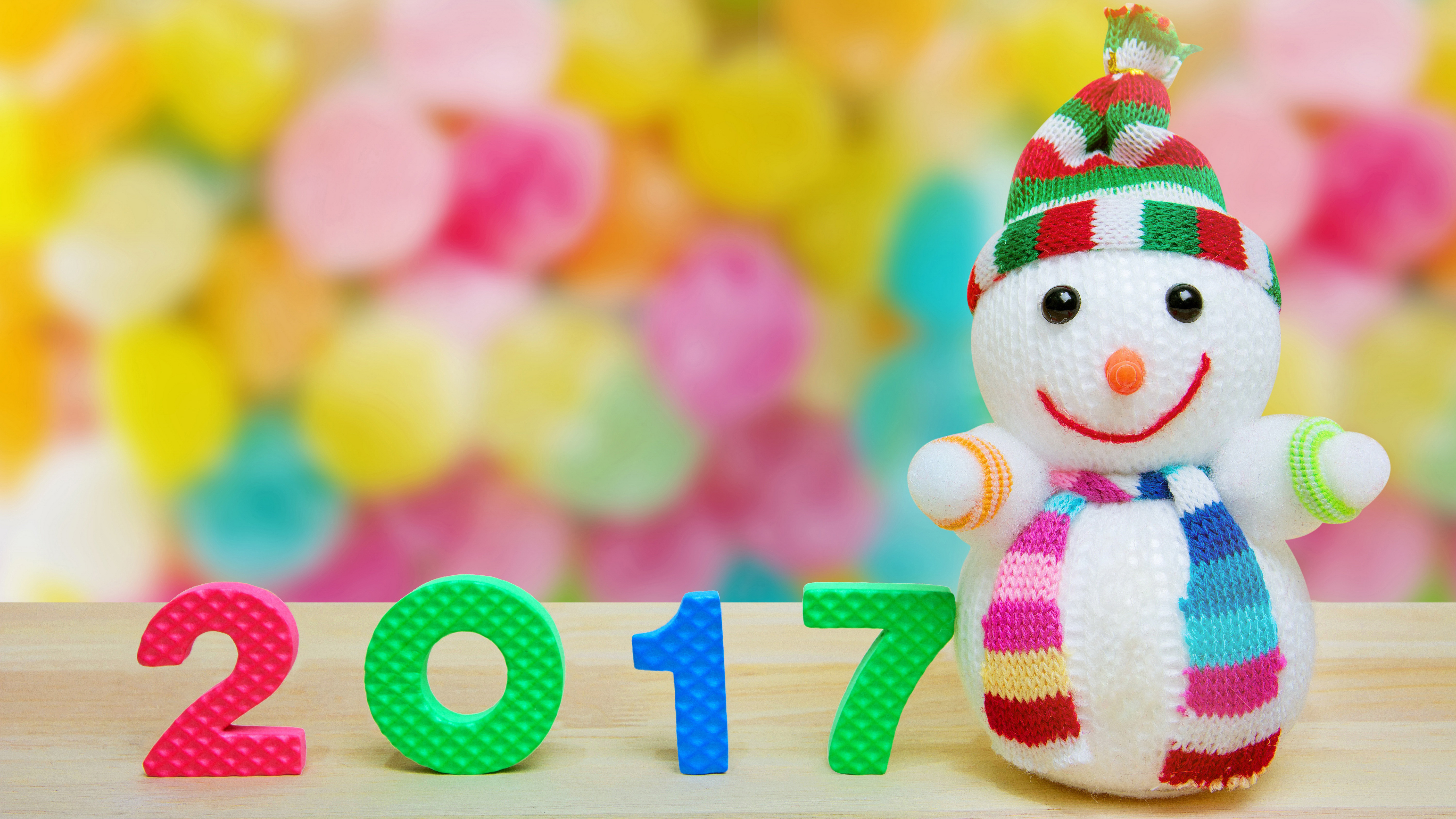 1528623 Hintergrundbild herunterladen feiertage, neujahr 2017, bokeh, farben, neujahr, schneemann - Bildschirmschoner und Bilder kostenlos