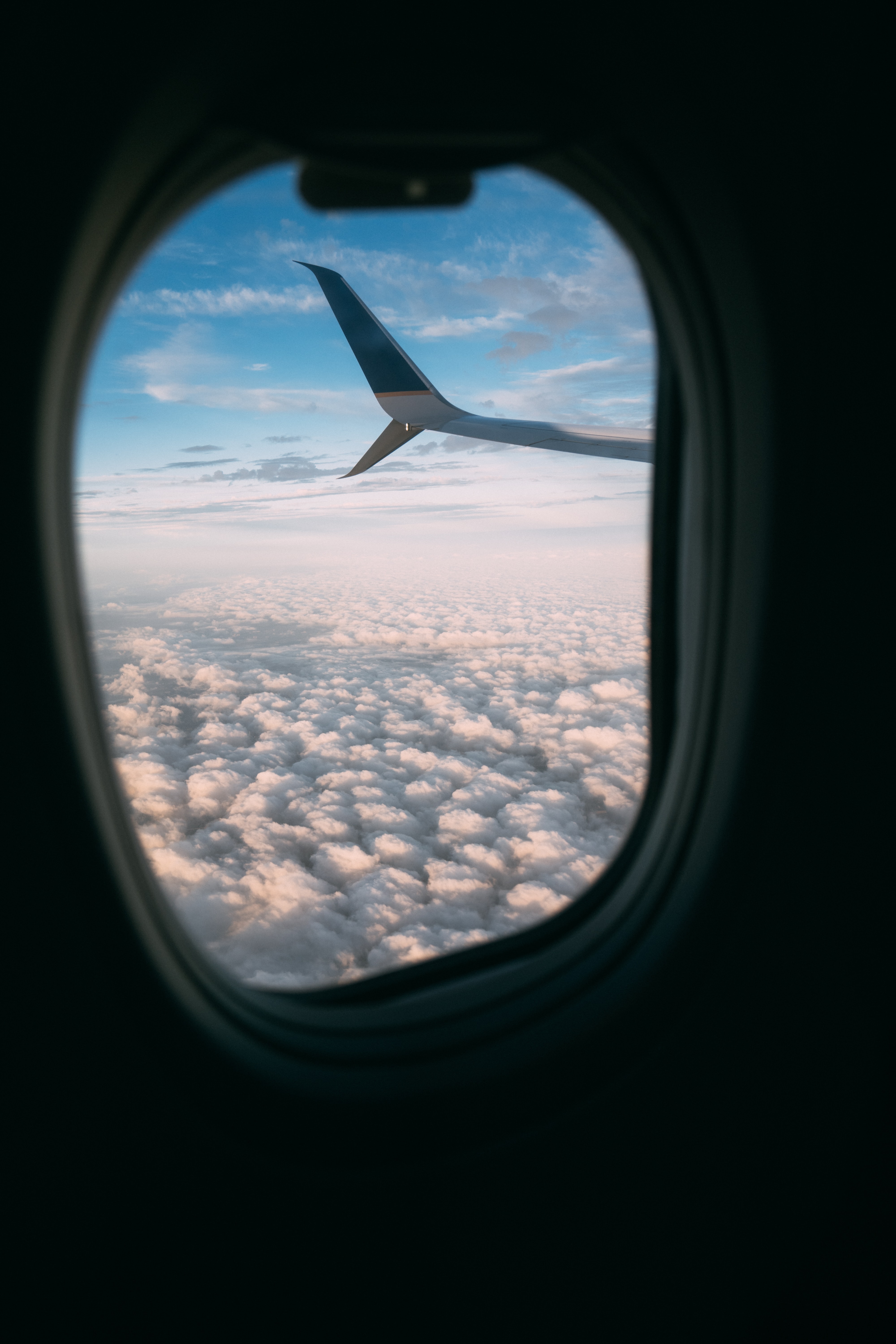 plane, clouds, porthole, miscellanea, miscellaneous, wing, airplane, view 32K