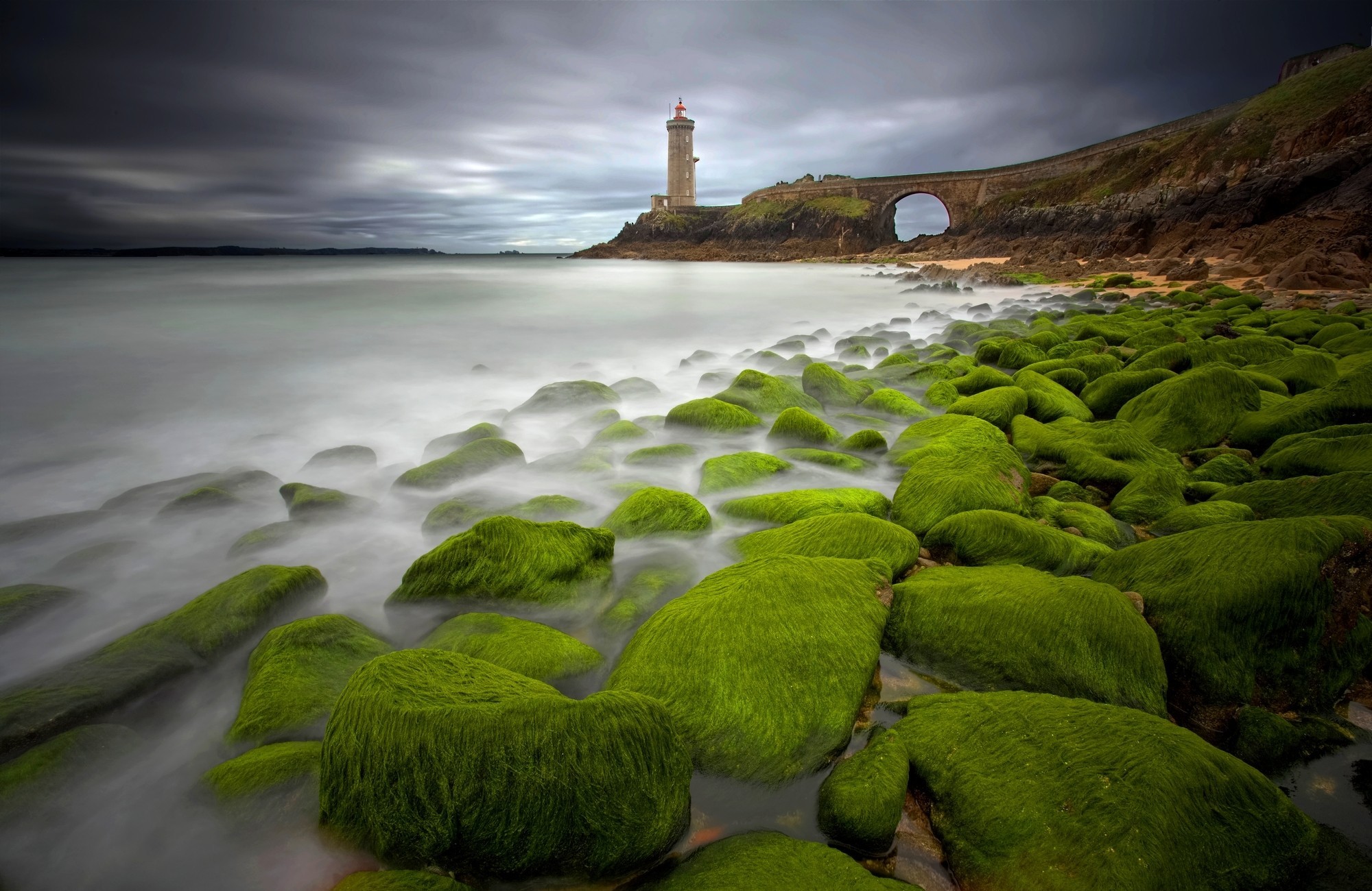 Download mobile wallpaper Stone, Lighthouse, Moss, Cloud, Man Made, Seashore for free.