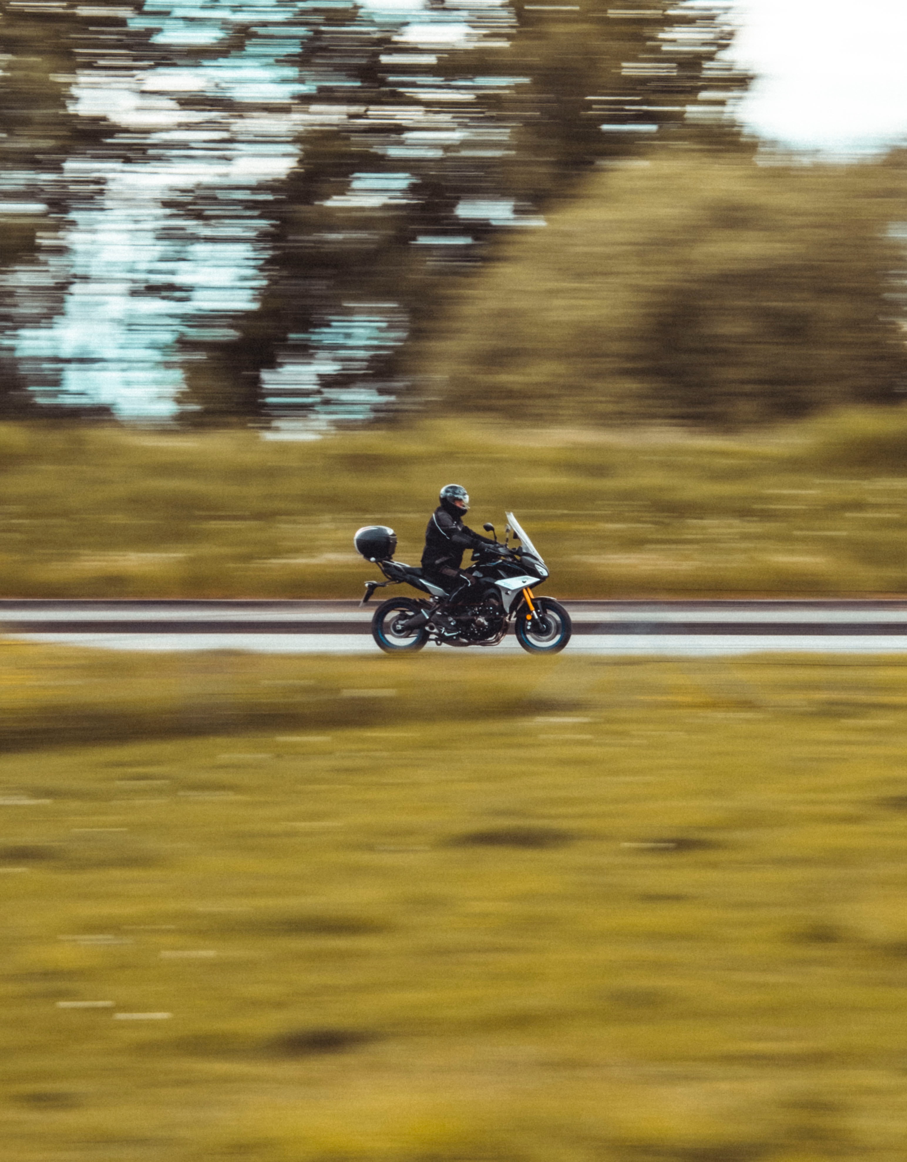 Download mobile wallpaper Smooth, Blur, Motorcycle, Helmet, Motorcycles, Motorcyclist, Bike for free.
