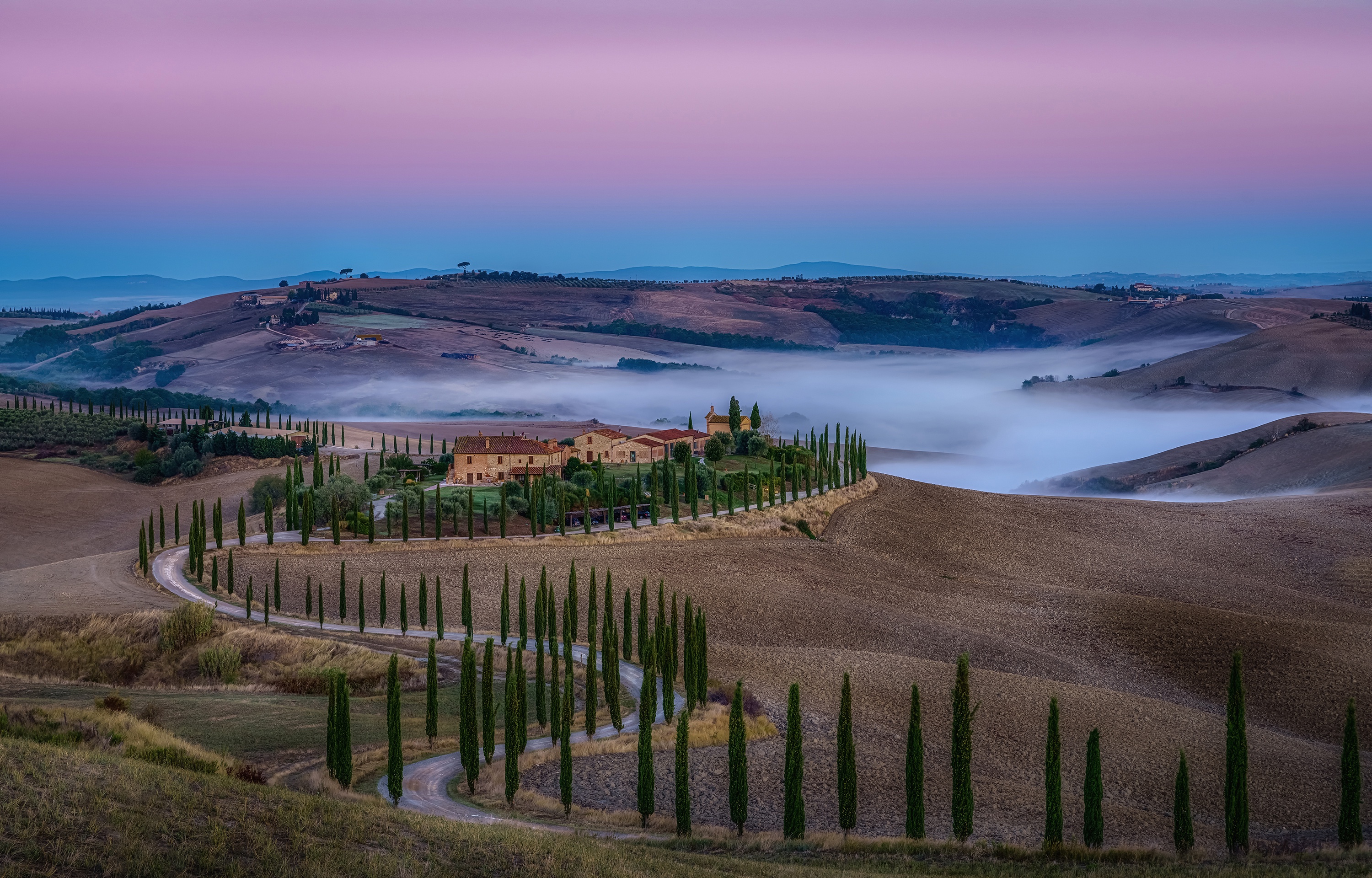 Download mobile wallpaper Landscape, Italy, Road, Fog, Hill, Photography, Tuscany for free.