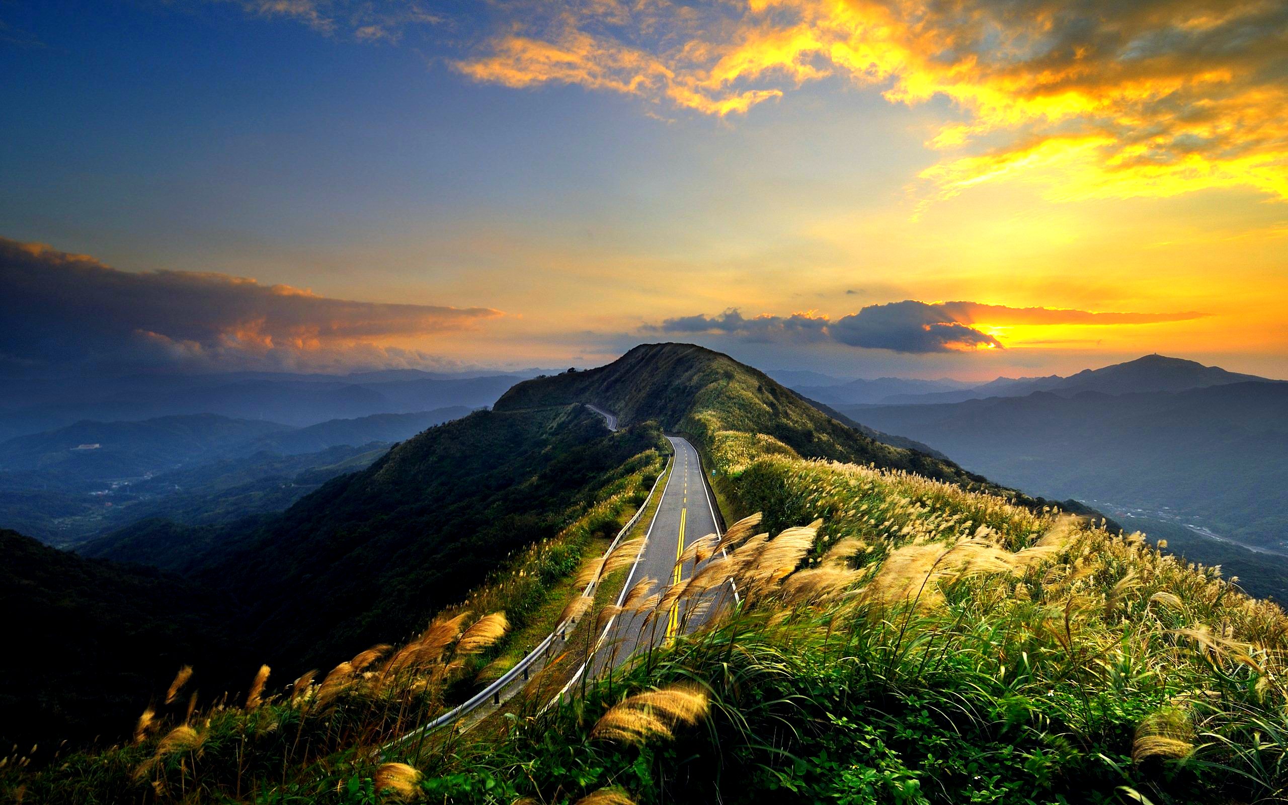 Free download wallpaper Sunset, Grass, Mountain, Road, Man Made on your PC desktop