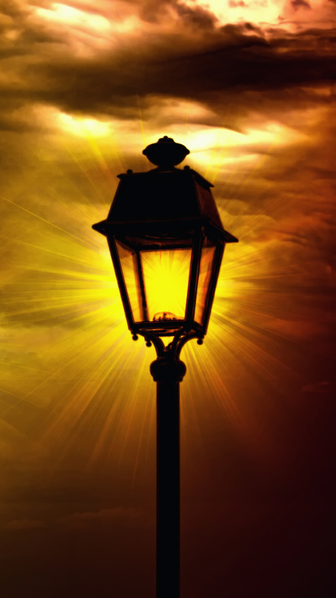 Download mobile wallpaper Sunset, Sky, Lighthouse, Lamp Post, Man Made, Street Light for free.