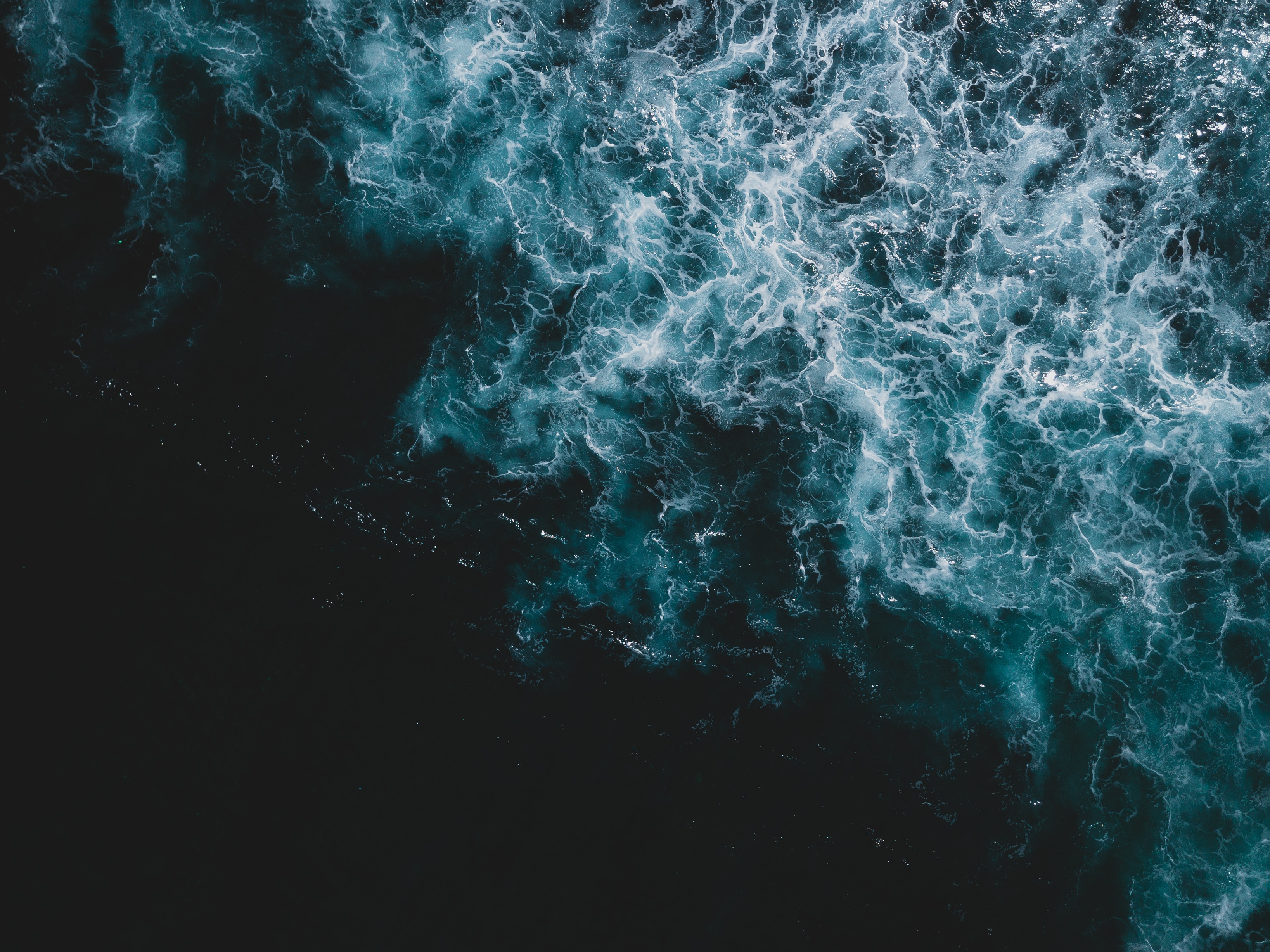 Download mobile wallpaper Waves, Nature, Water, View From Above, Sea, Surface, Dark for free.