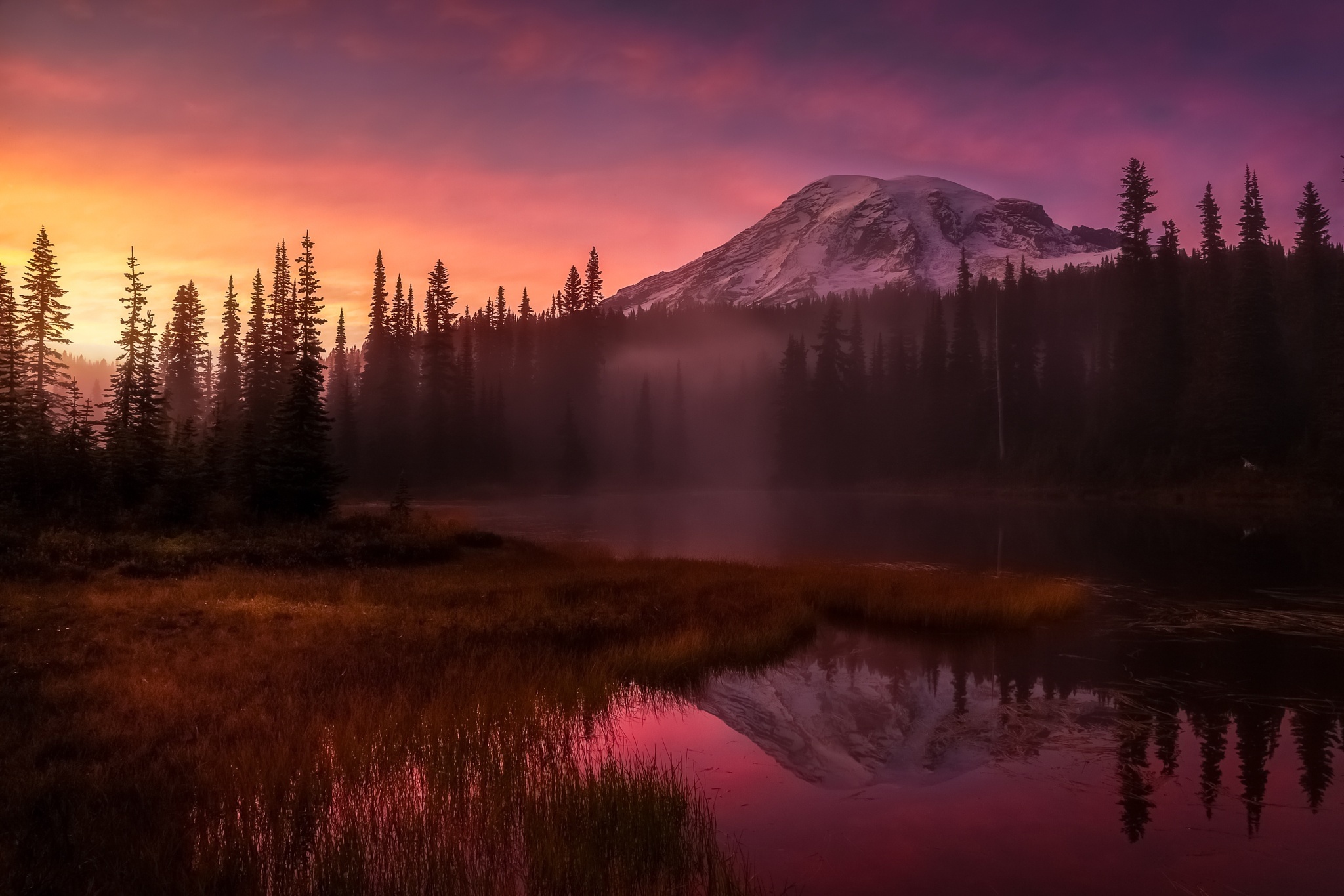 Download mobile wallpaper Nature, Sunset, Mountain, Reflection, Forest, Fog, Earth for free.