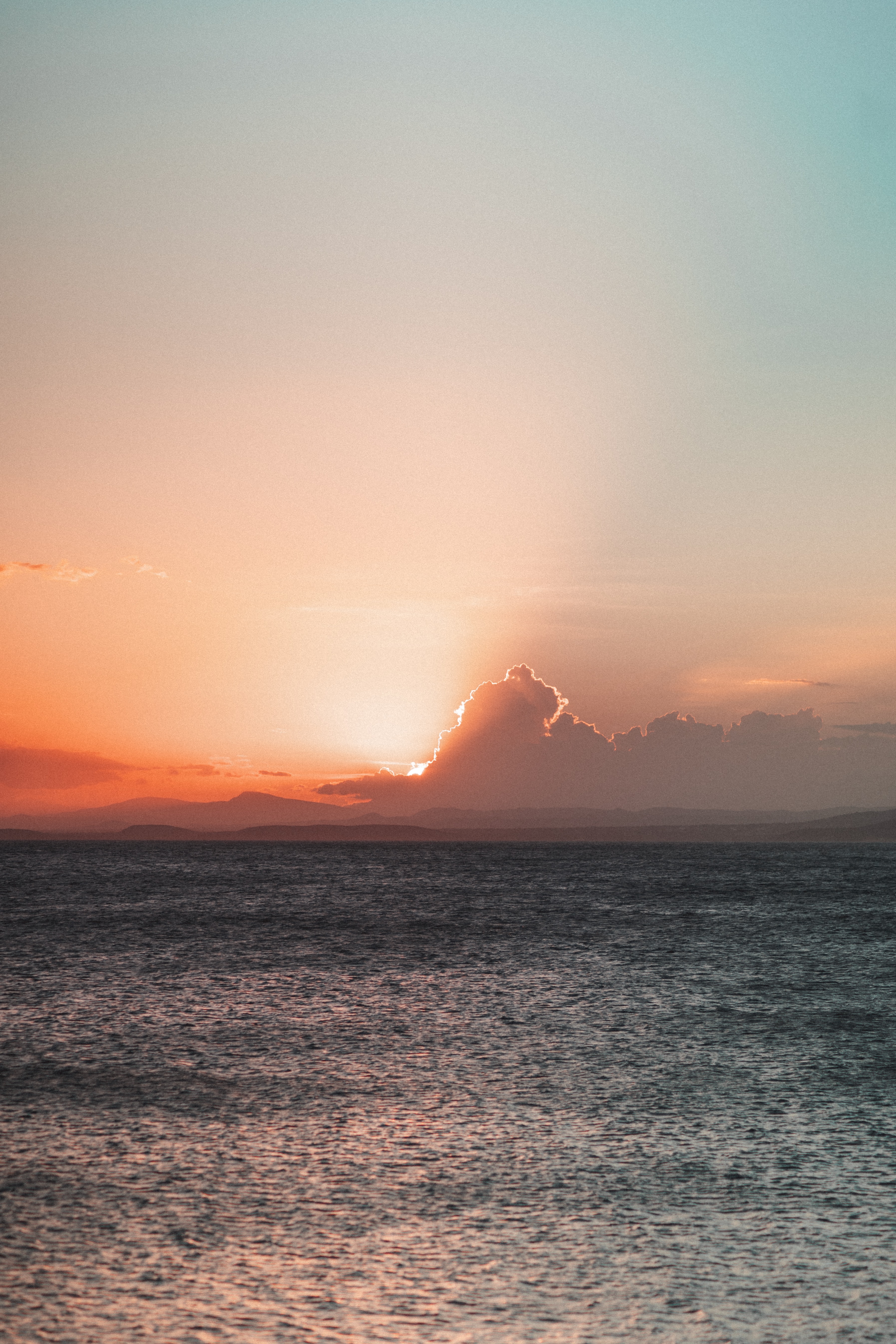 Download mobile wallpaper Clouds, Sunset, Horizon, Sea, Nature for free.