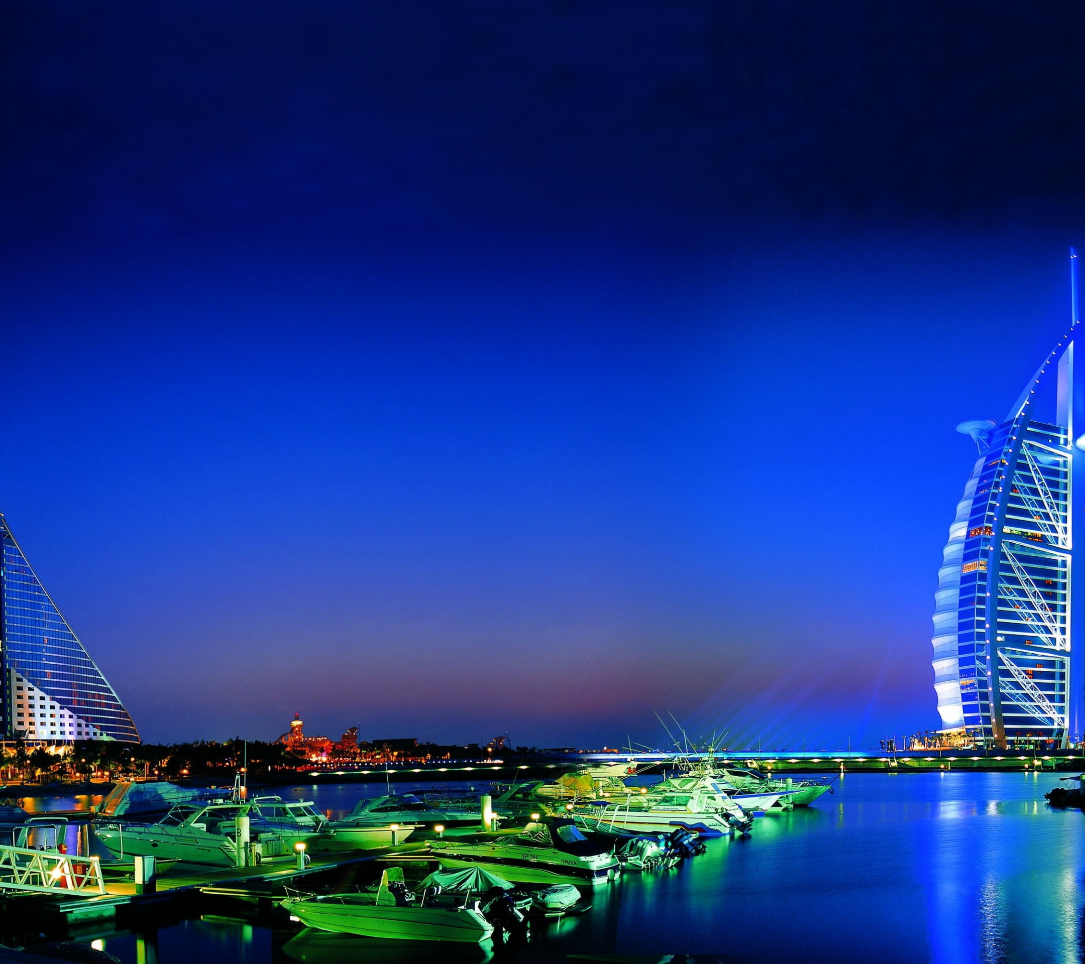 Download mobile wallpaper Night, City, Building, Dubai, Boat, Harbor, Burj Al Arab, Man Made for free.