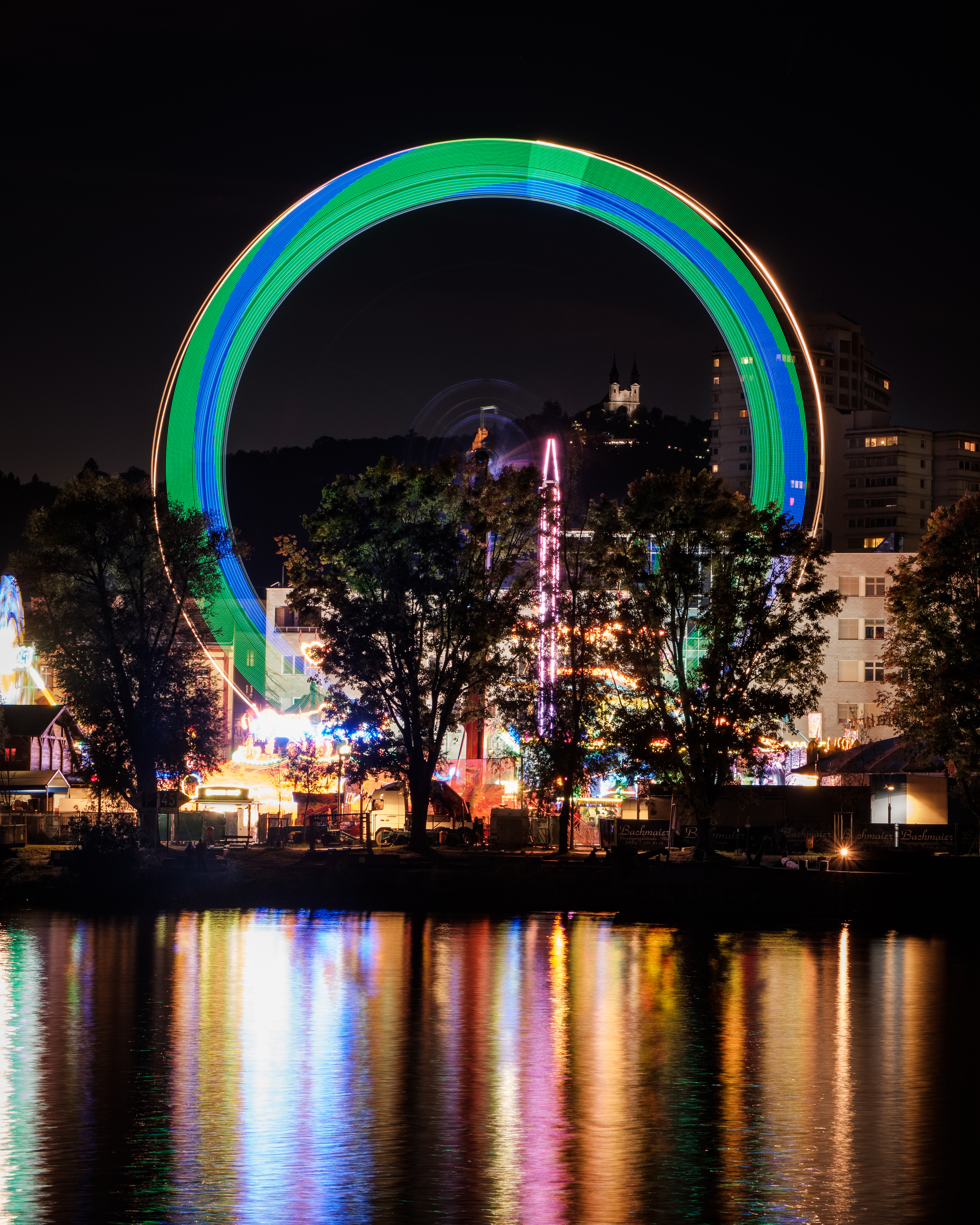 Download mobile wallpaper Long Exposure, Ferris Wheel, Cities, Rivers, Shine, Light, Night City for free.