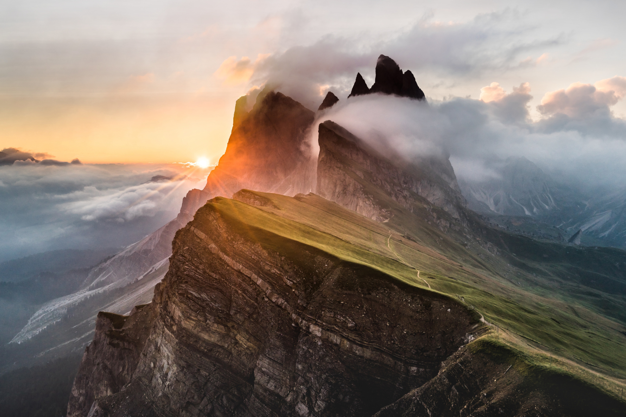Download mobile wallpaper Nature, Sunset, Mountains, Mountain, Peak, Fog, Earth, Sunbeam, Sunbean for free.