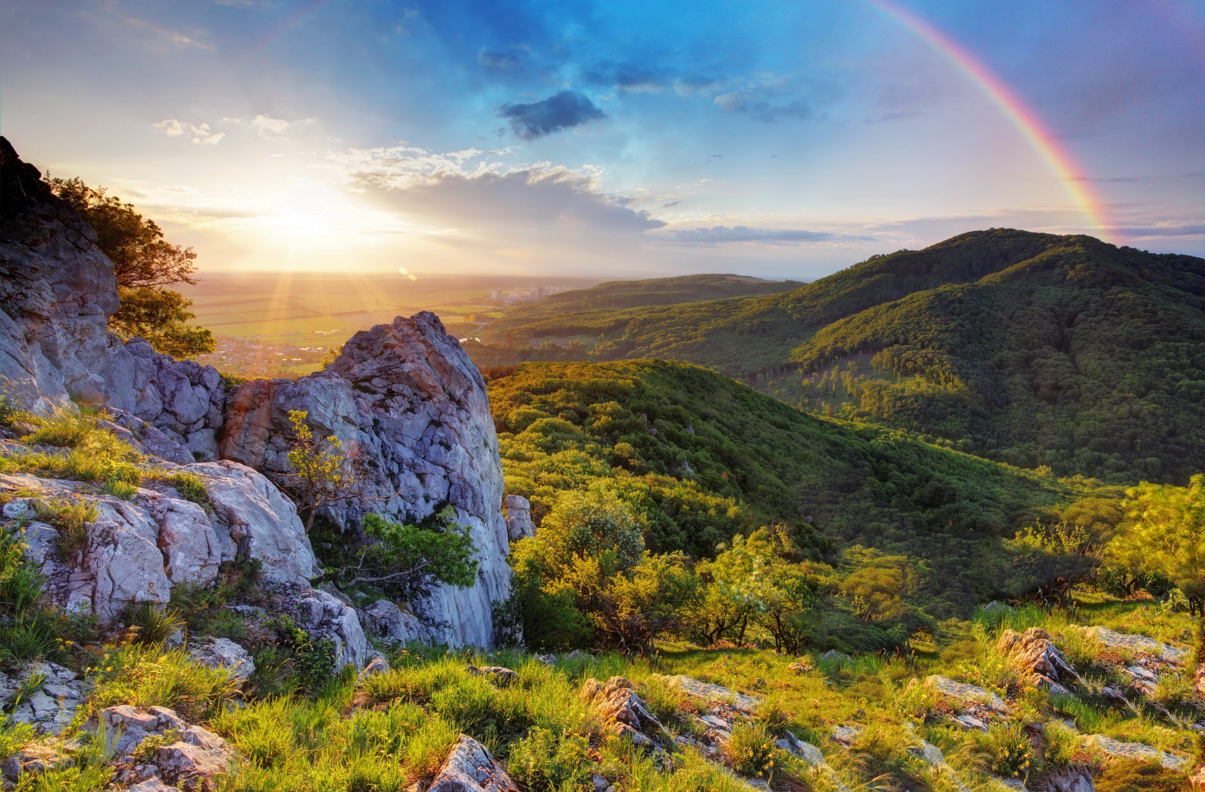 Download mobile wallpaper Rainbow, Earth, Valley, Sunshine for free.