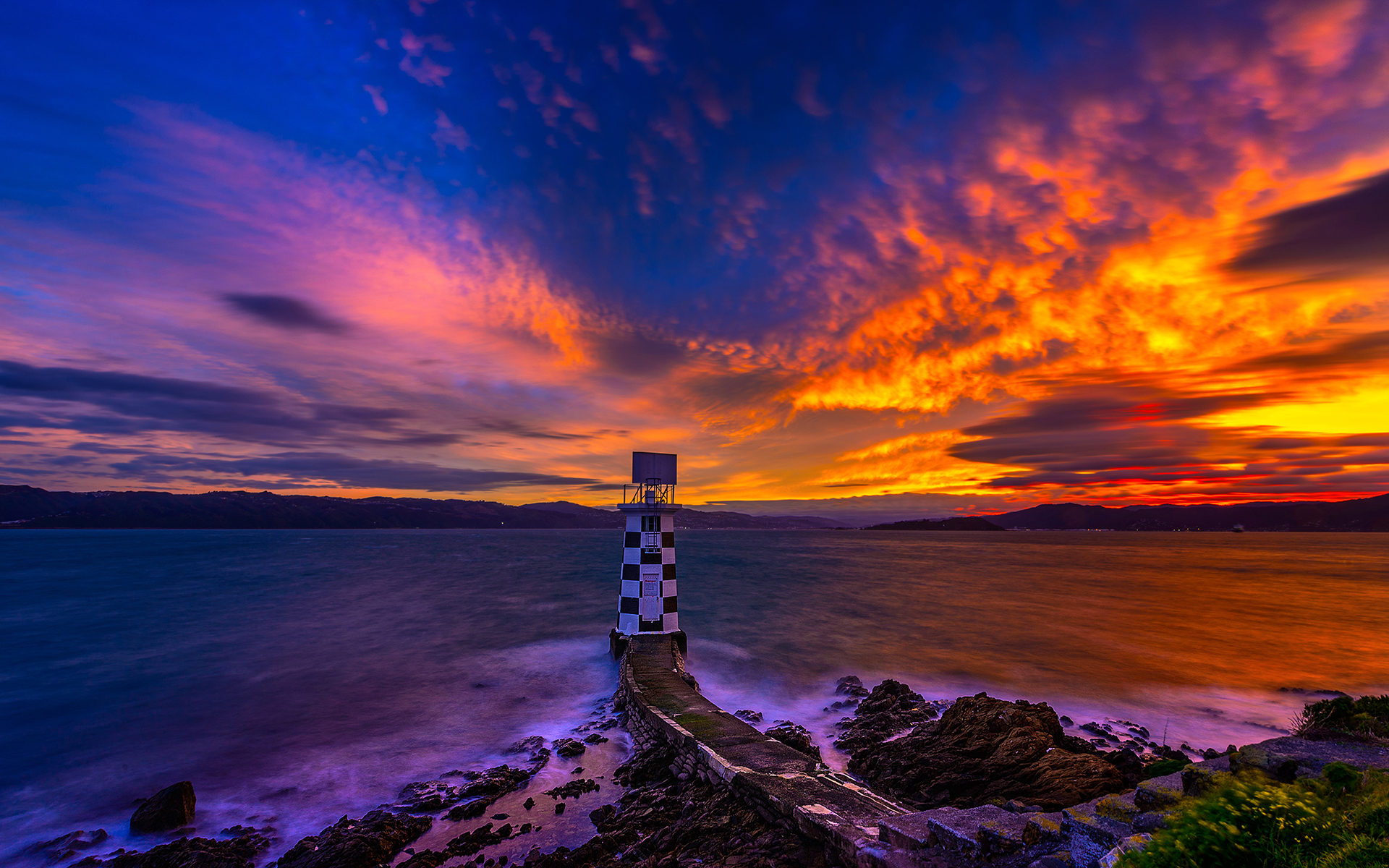 Free download wallpaper Sunset, Sky, Sea, Ocean, Lighthouse, Man Made on your PC desktop