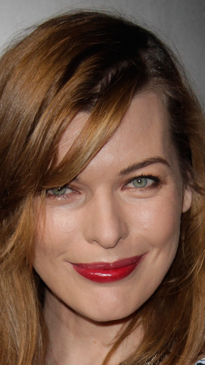 Download mobile wallpaper Milla Jovovich, Redhead, Face, Blue Eyes, American, Celebrity, Actress, Lipstick for free.