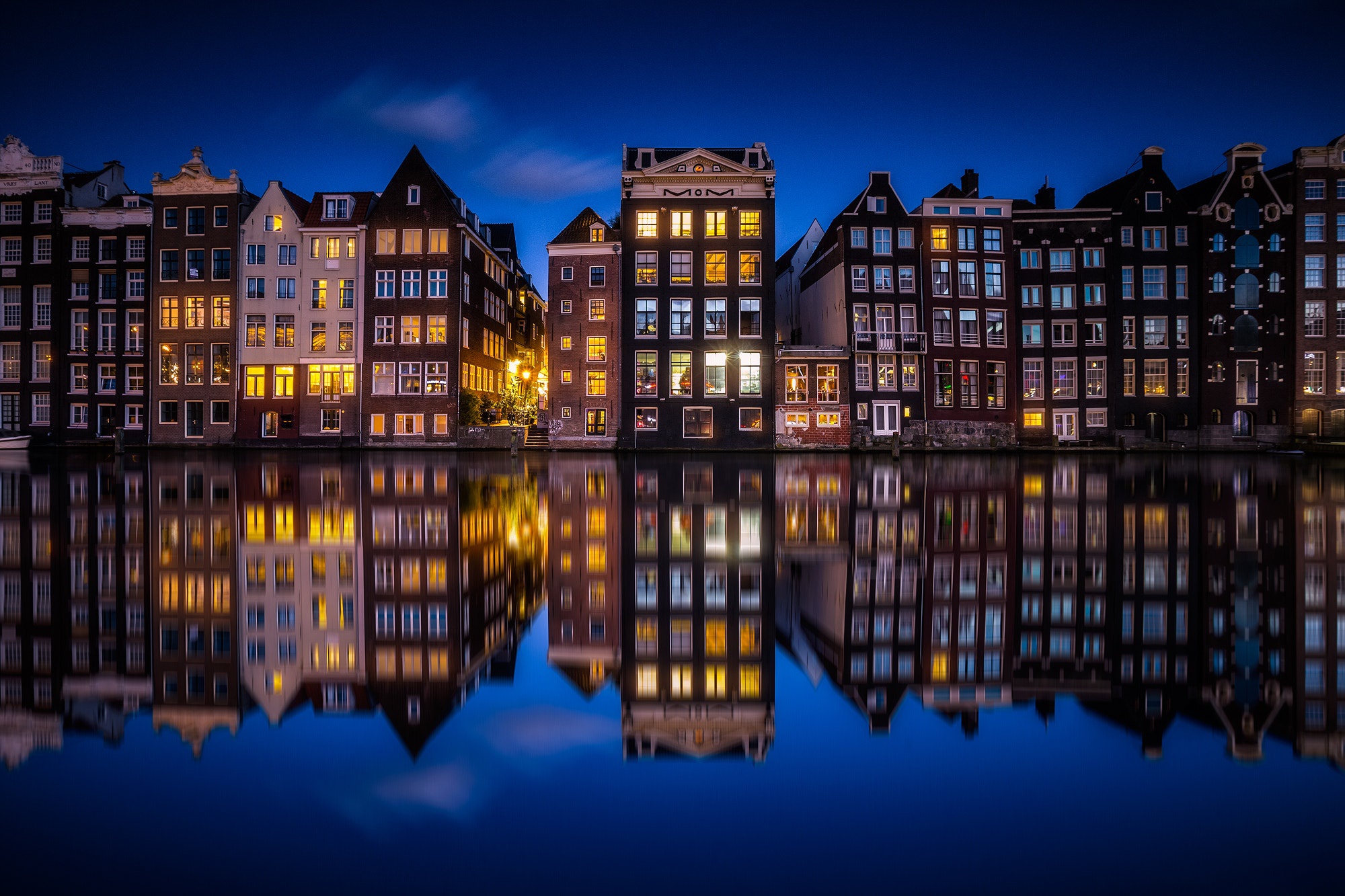 Download mobile wallpaper Cities, Night, City, Reflection, House, Netherlands, Amsterdam, Man Made, Canal for free.
