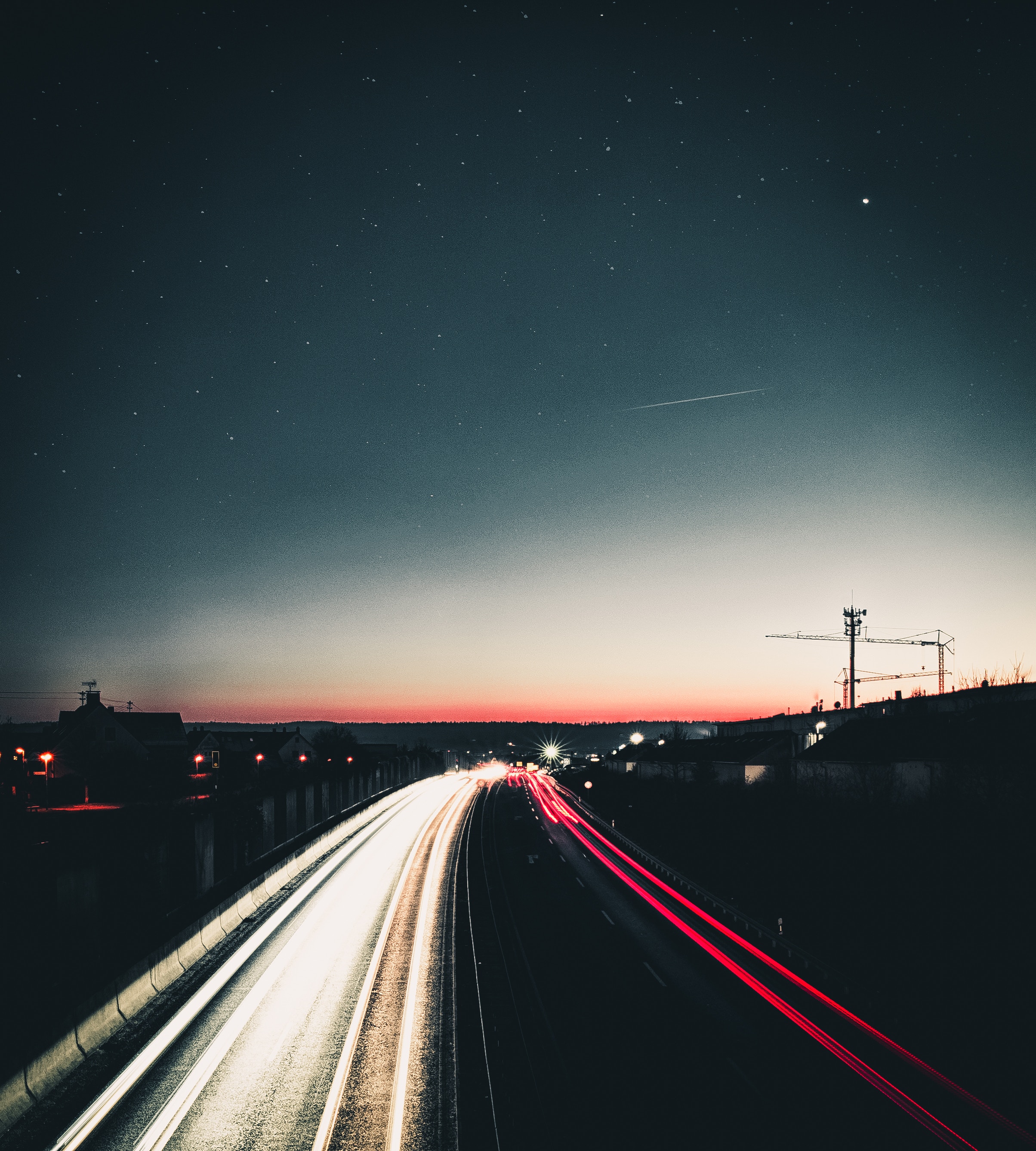 Download mobile wallpaper Road, Turn, Cities, Sky, Shine, Light, Night for free.