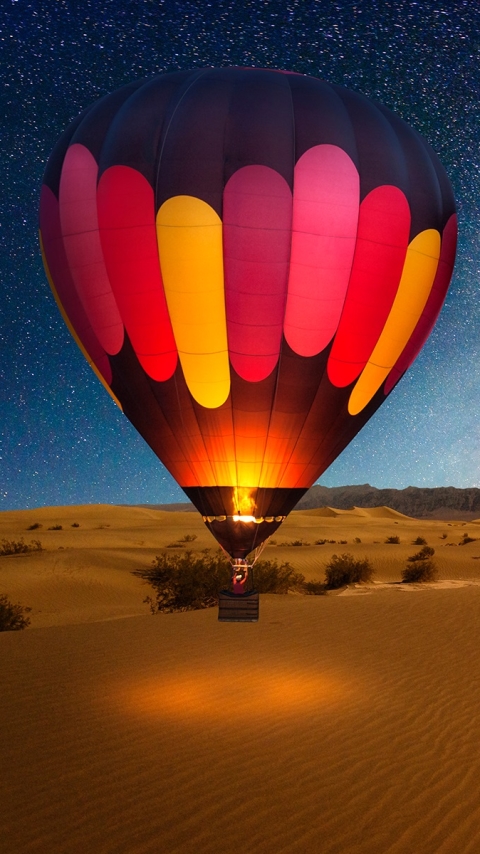 Handy-Wallpaper Sterne, Wüste, Steppe, Nacht, Fahrzeug, Fahrzeuge, Heißluftballon, Sternenklarer Himmel kostenlos herunterladen.