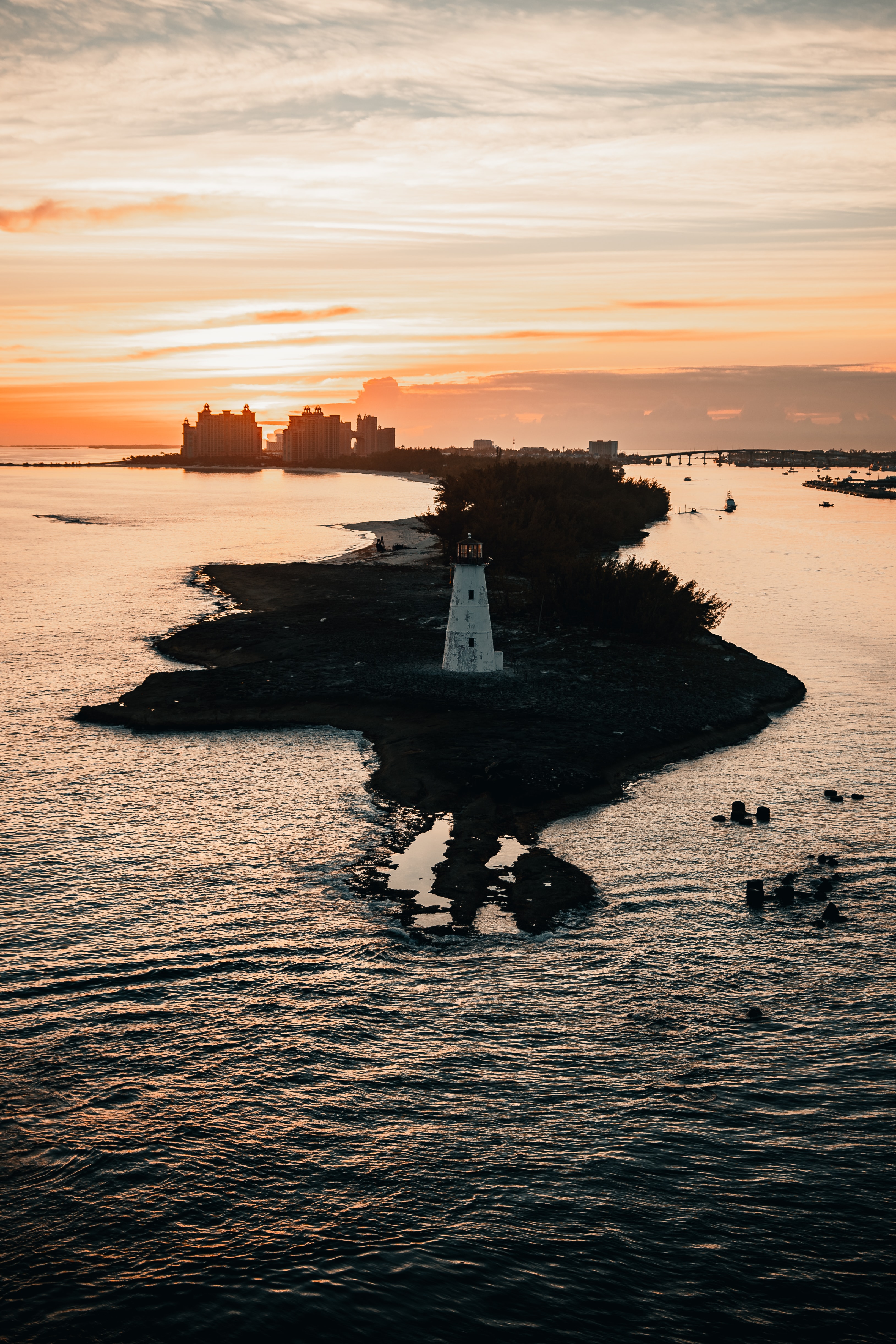 Free download wallpaper Miscellanea, Miscellaneous, Lighthouse, Building, Tower, Island, Sea, Sunset on your PC desktop