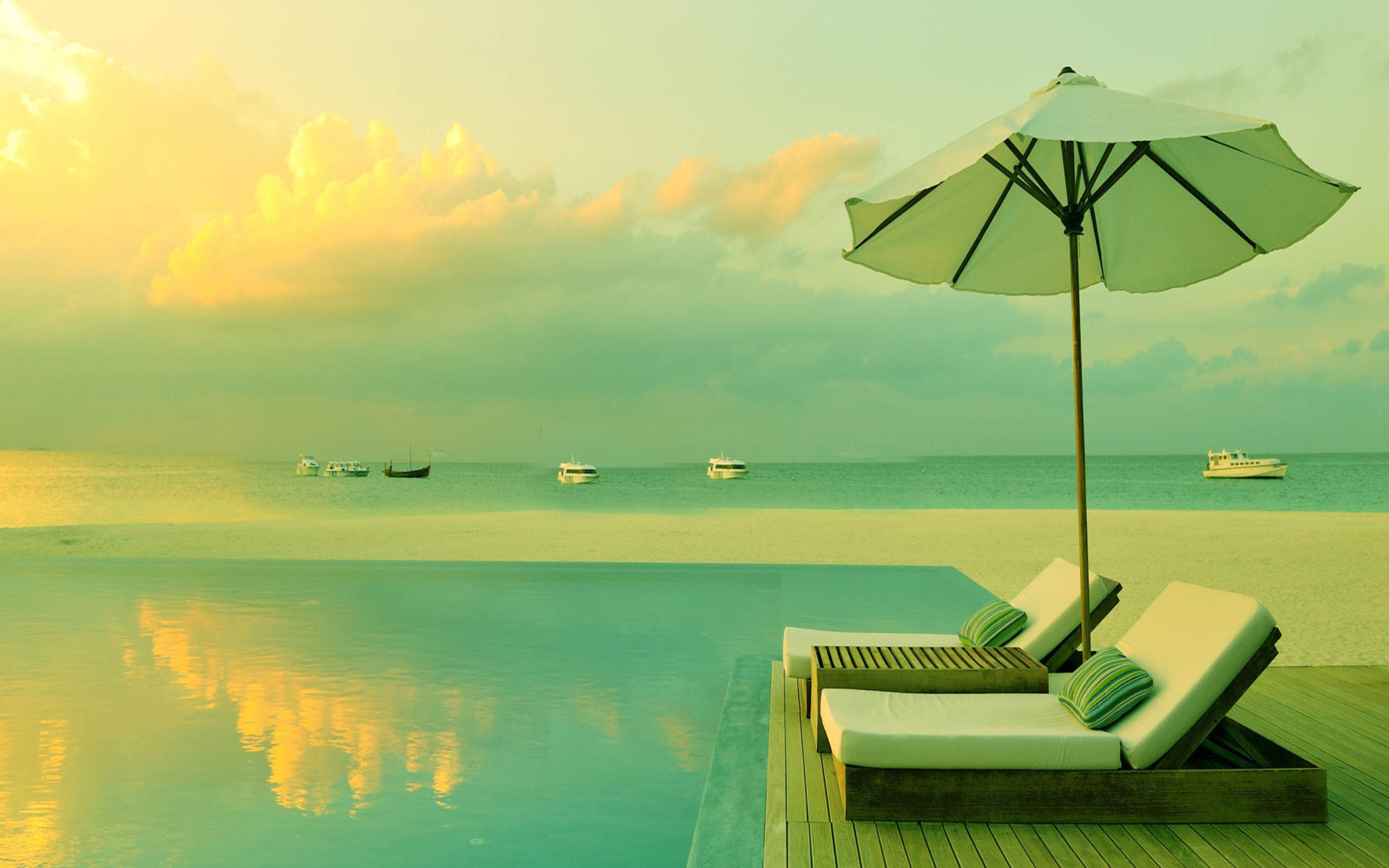 Download mobile wallpaper Sky, Beach, Ocean, Dusk, Tropical, Cloud, Resort, Pool, Luxury, Man Made for free.