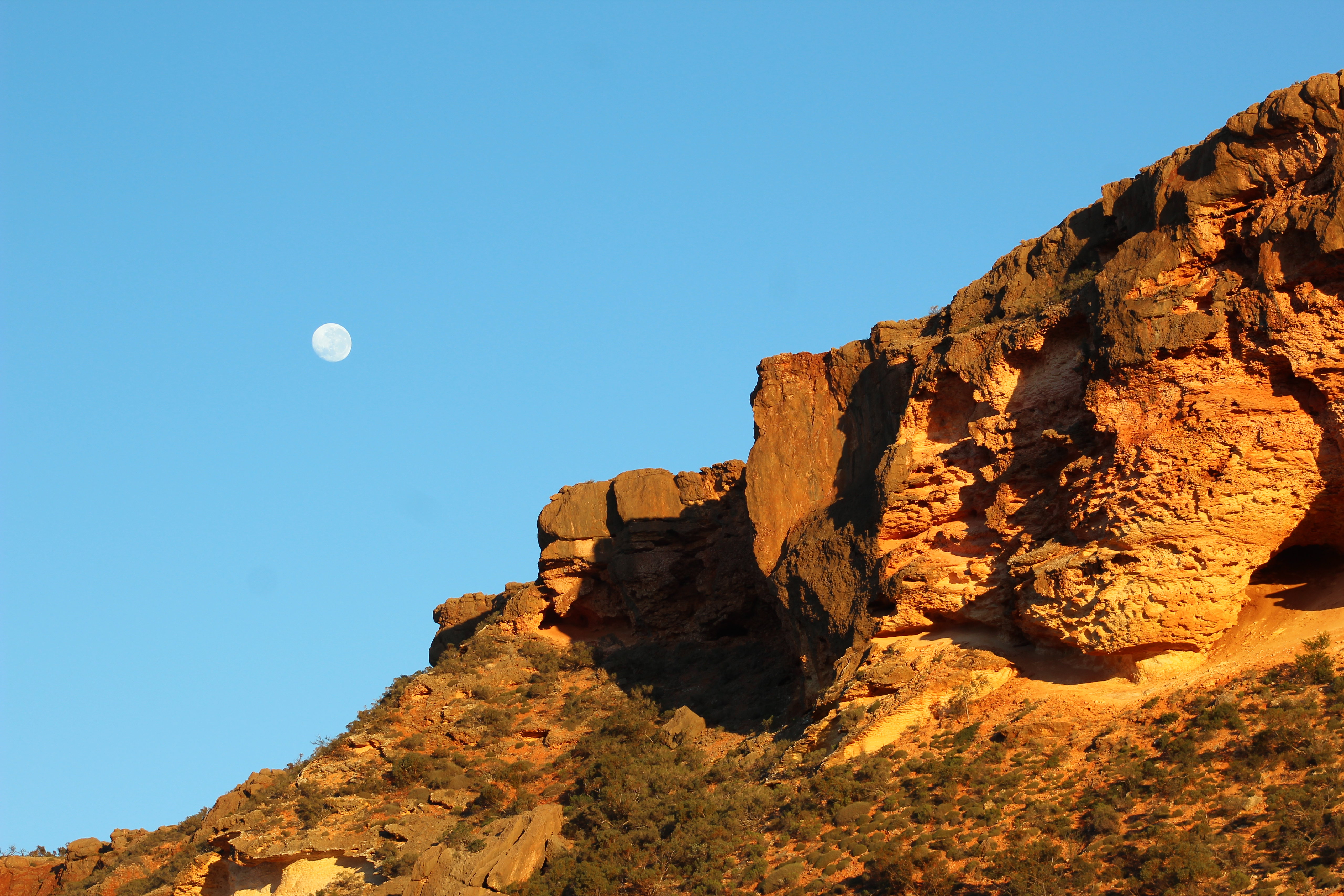 Download mobile wallpaper Rocks, Slope, Sky, Nature, Moon for free.