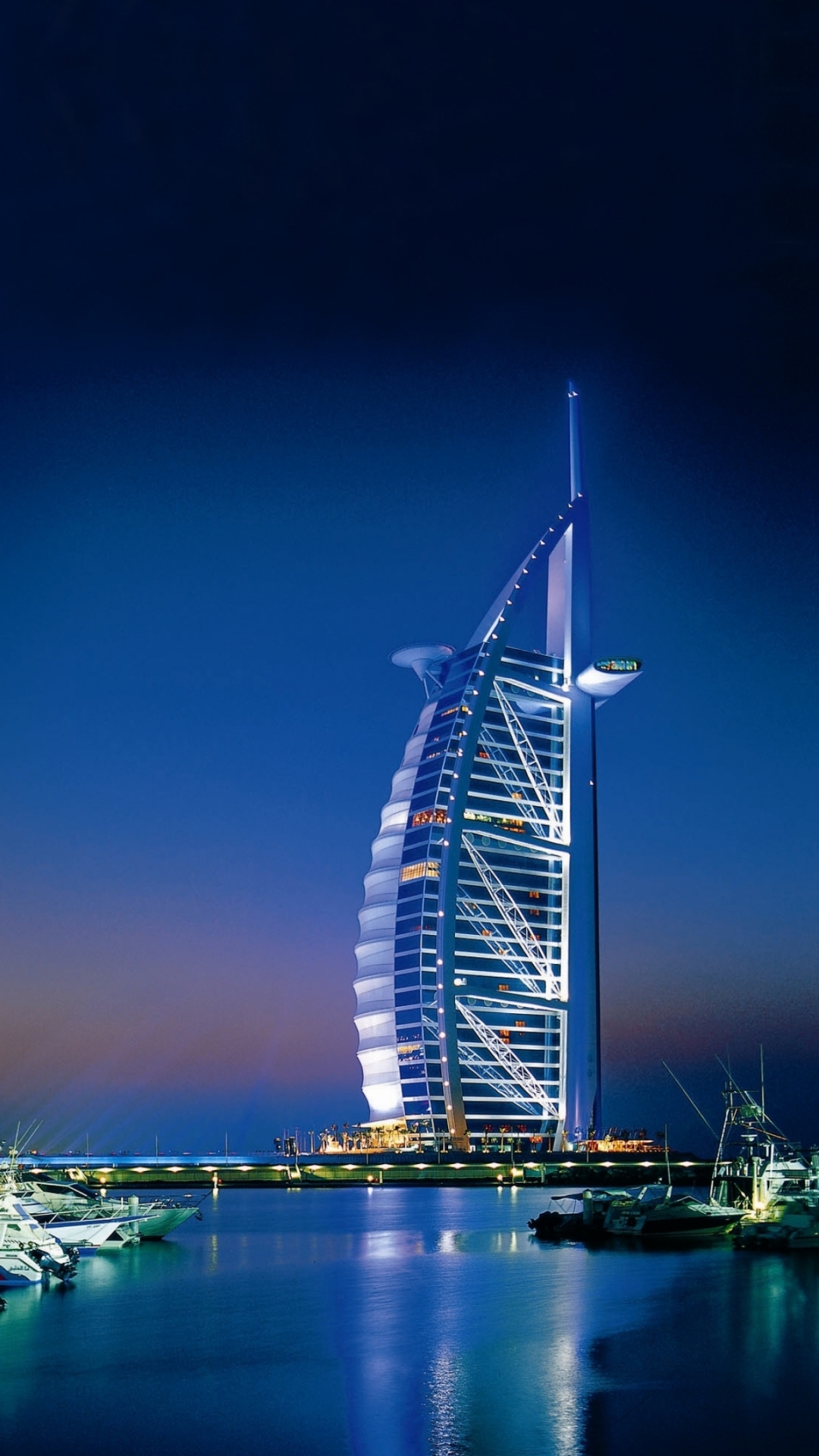 Download mobile wallpaper Night, City, Building, Dubai, Boat, Harbor, United Arab Emirates, Burj Al Arab, Man Made for free.