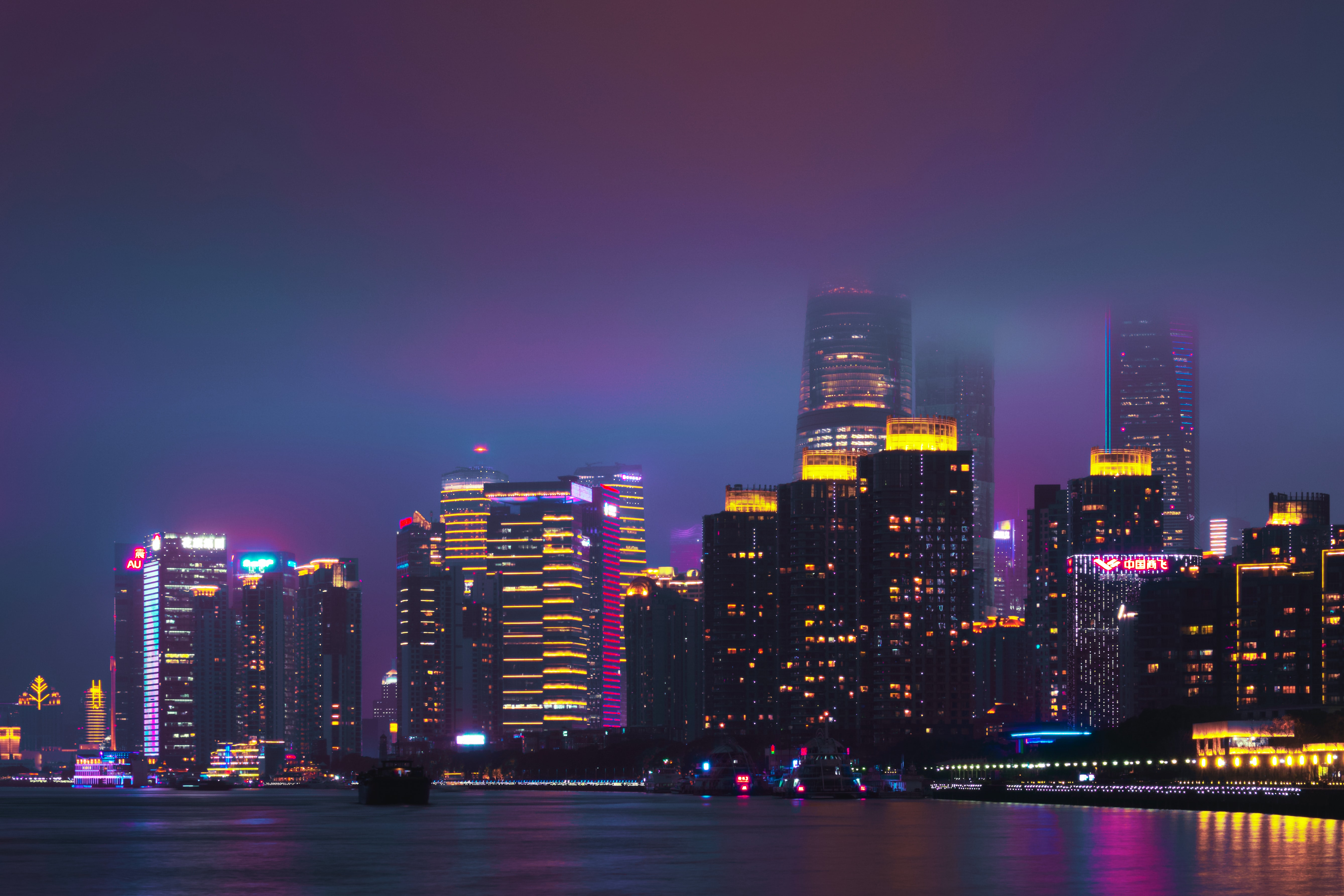 Download mobile wallpaper Cities, City, Building, Night City, Water, Violet, Purple for free.