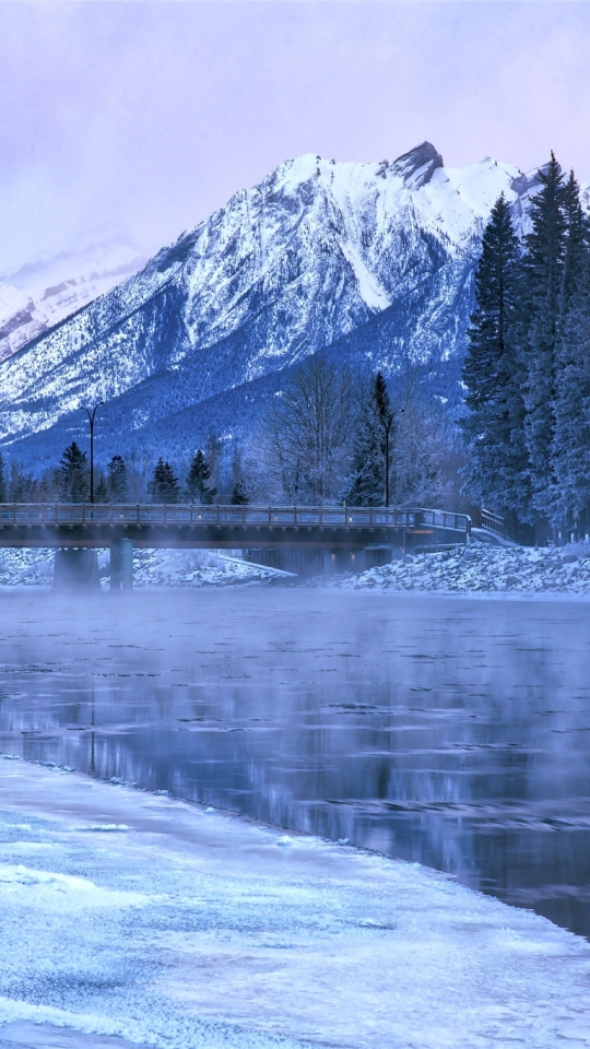 Скачать картинку Зима, Природа, Река, Лед, Гора, Мост, Фотографии, Лёд в телефон бесплатно.