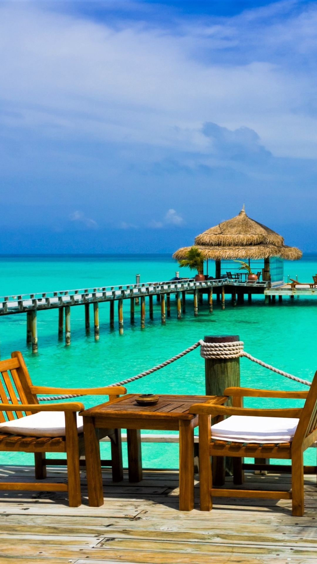 Download mobile wallpaper Sea, Horizon, Pier, Chair, Ocean, Tropical, Resort, Man Made for free.