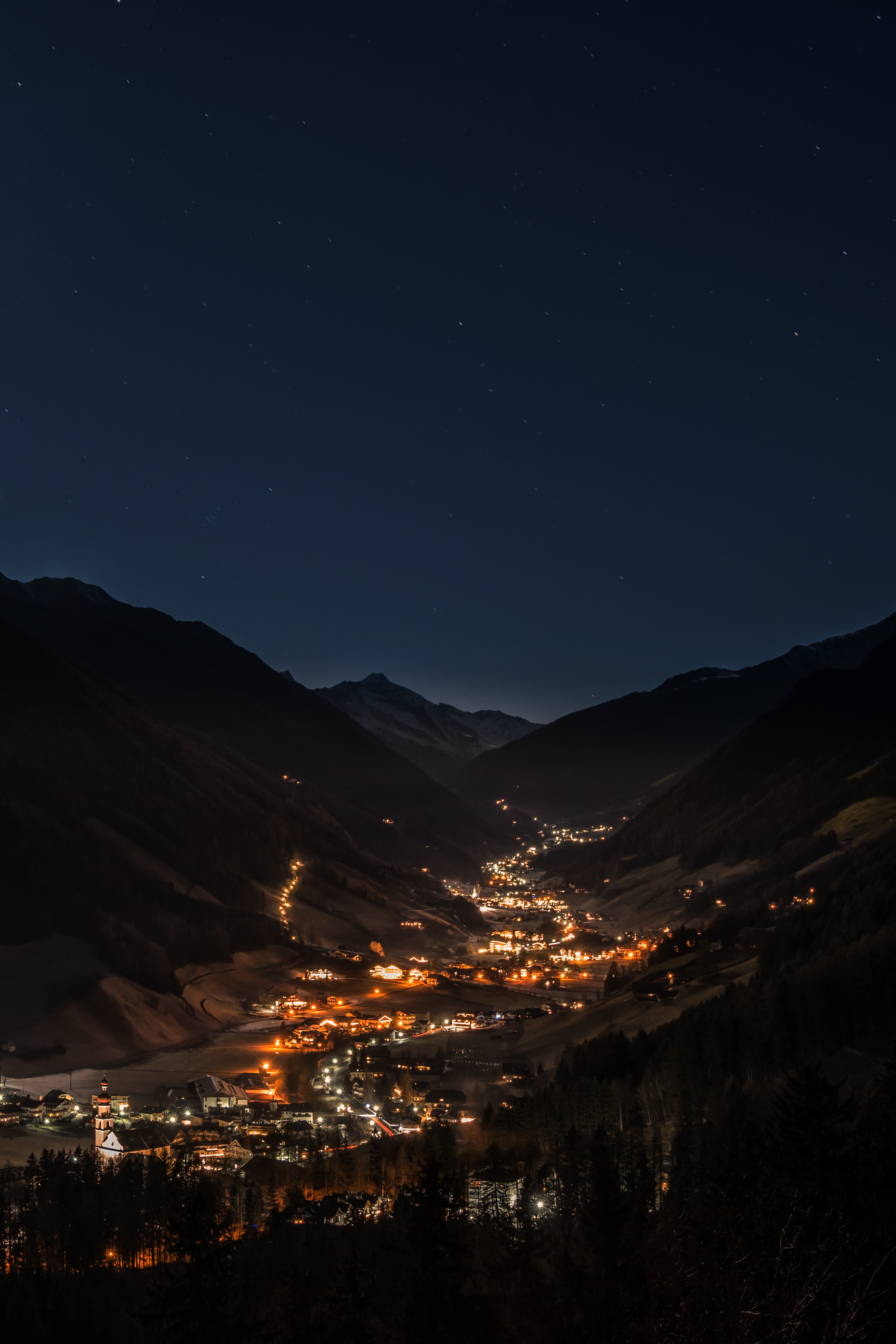 night, cities, structure, mountains, sky HD wallpaper