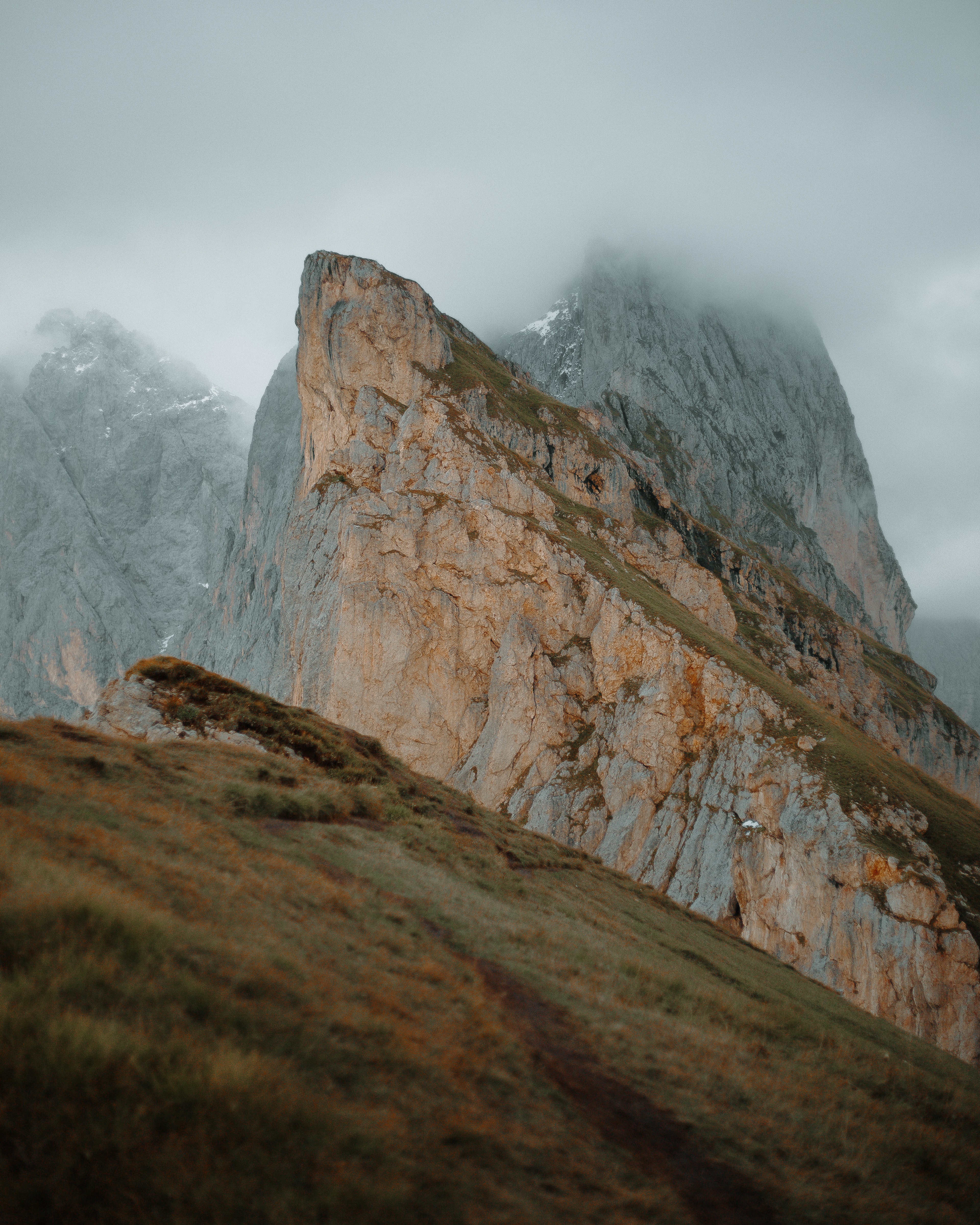 Download mobile wallpaper Slope, Rock, Cliff, Fog, Mountains, Nature for free.