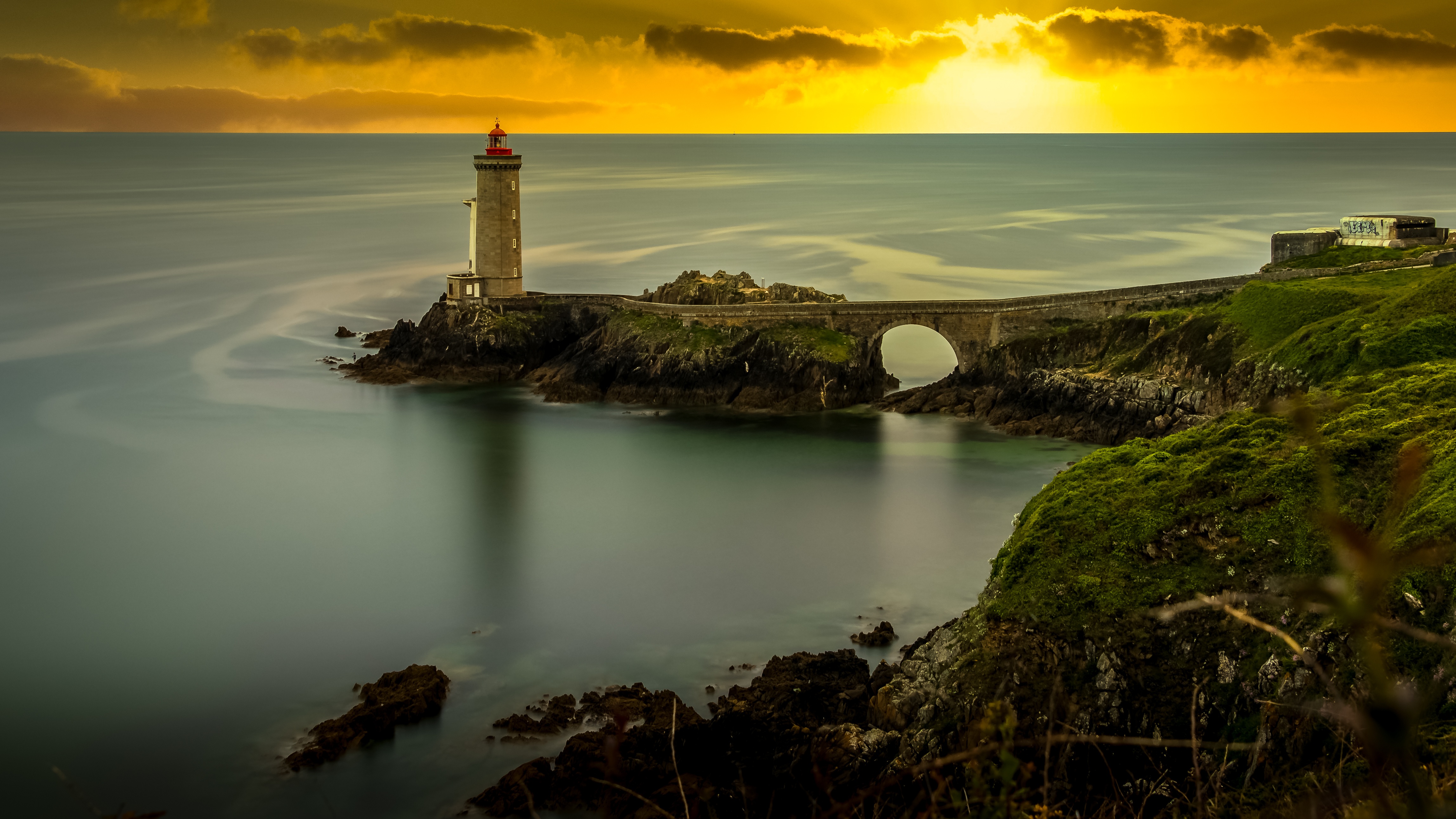 Free download wallpaper Sunset, Horizon, Ocean, France, Bridge, Lighthouse, Man Made on your PC desktop