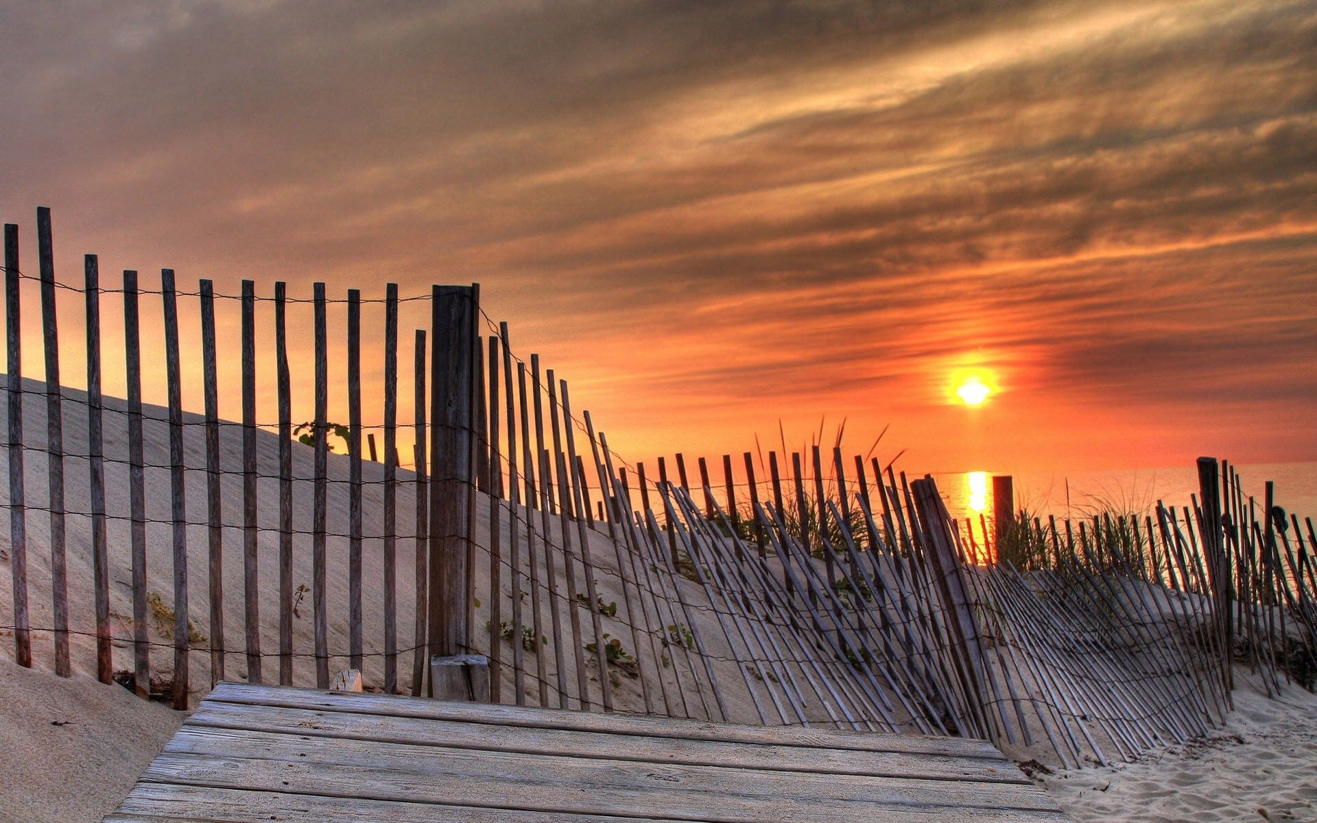 Download mobile wallpaper Fence, Reiki, Evening, Nature, Sand, Sun, Sunset, Beach for free.