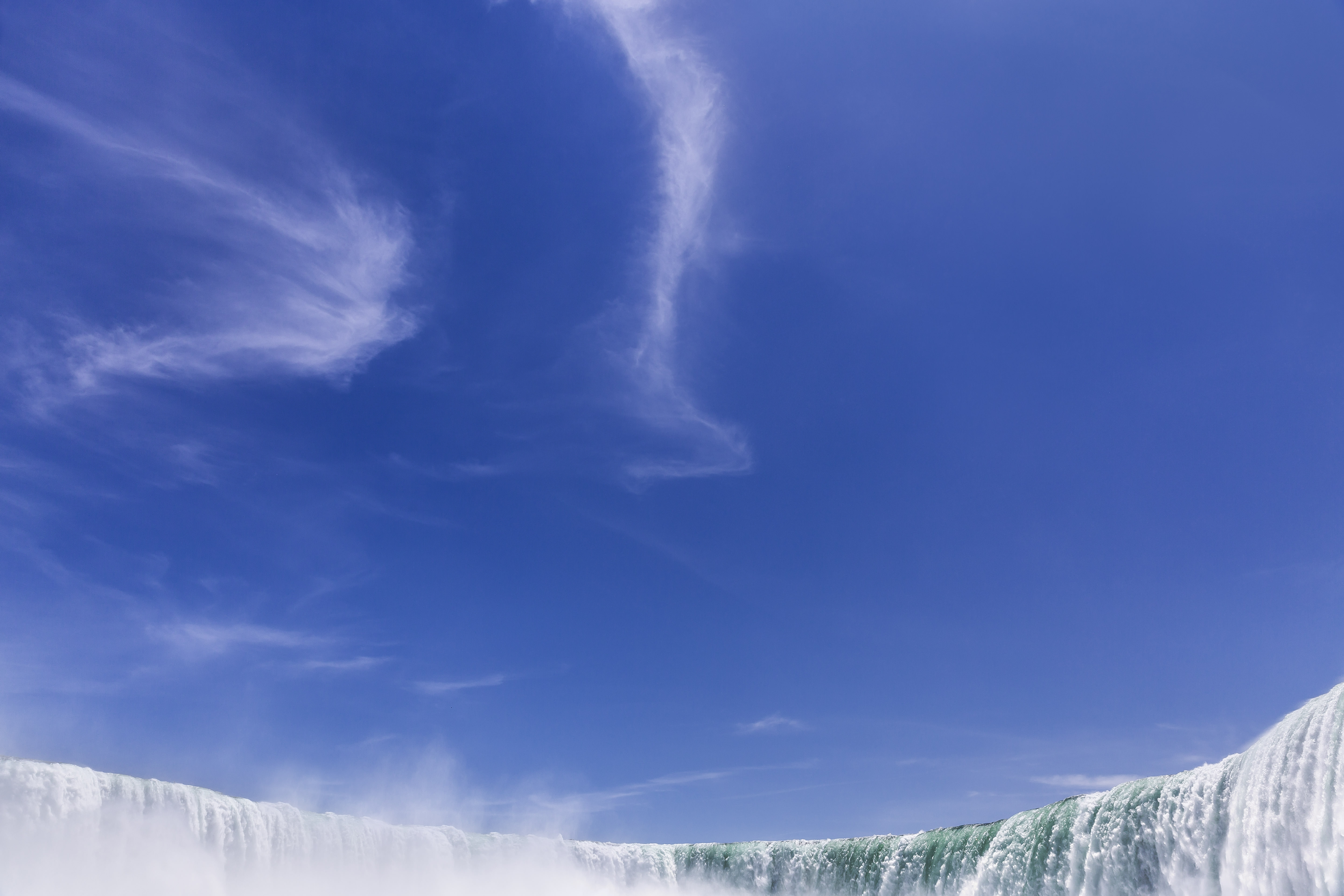 Download mobile wallpaper Nature, Sky, Waterfalls, Waterfall, Earth, Cloud for free.