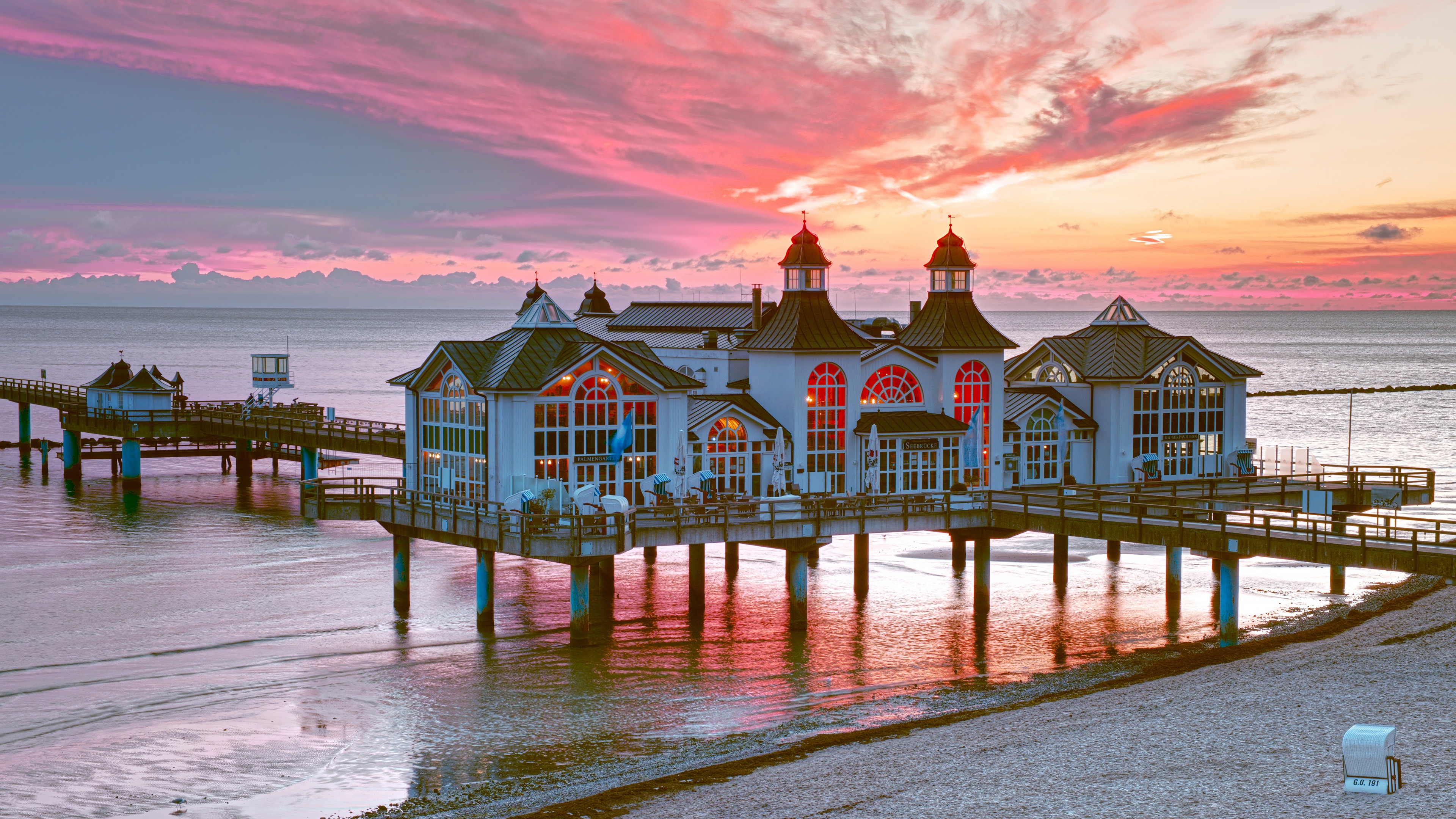 Download mobile wallpaper Sunset, Sea, Beach, Building, Horizon, Coast, Pier, Cloud, Man Made for free.