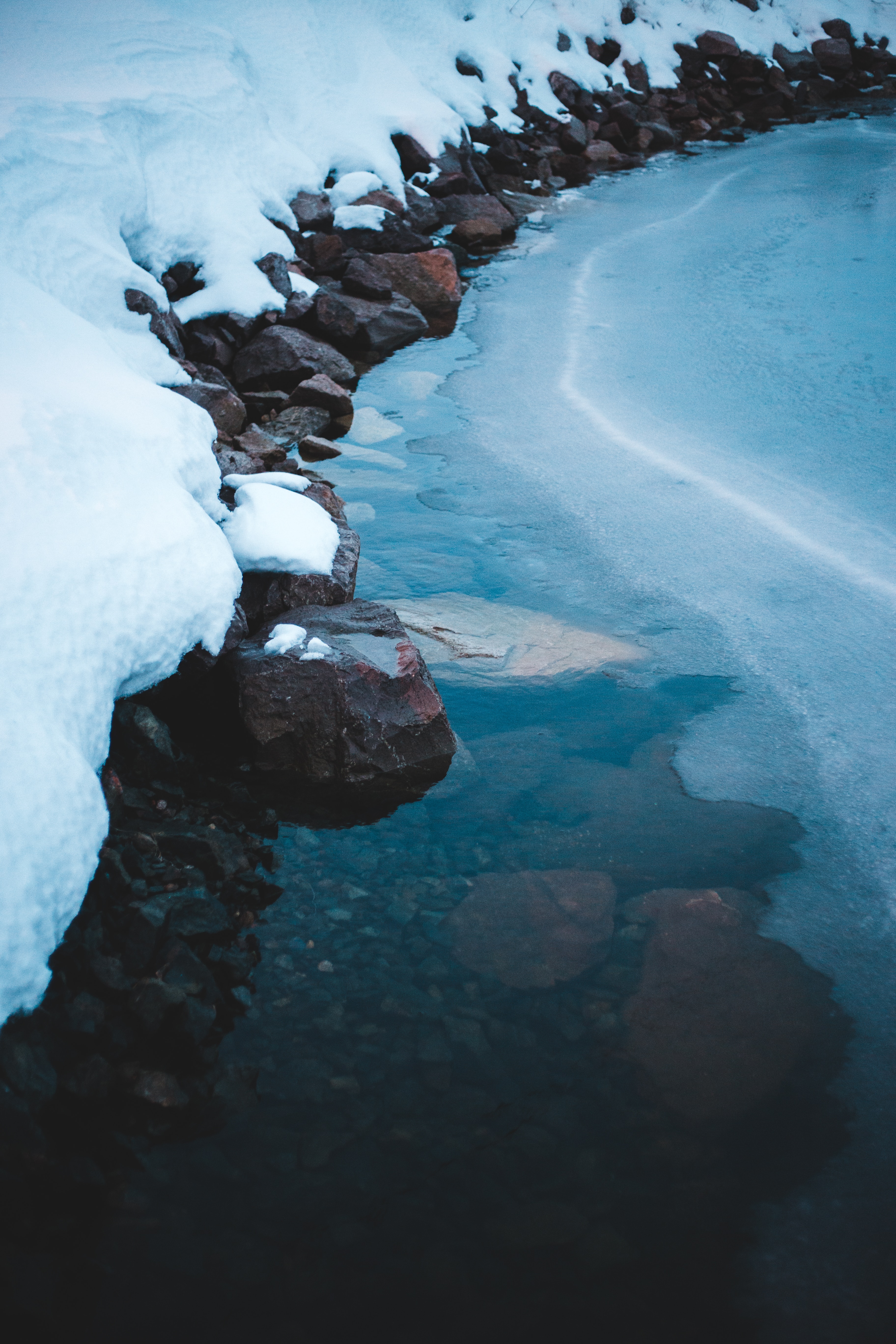 Download mobile wallpaper Bank, Snow, Shore, Nature, Stones, Ice, Frozen for free.