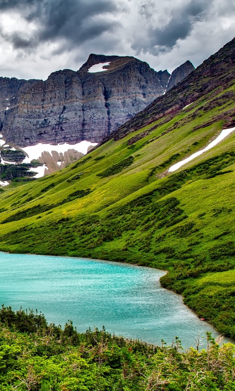 Download mobile wallpaper Nature, Grass, Lakes, Mountain, Lake, Earth, Cliff, Montana, Glacier National Park for free.
