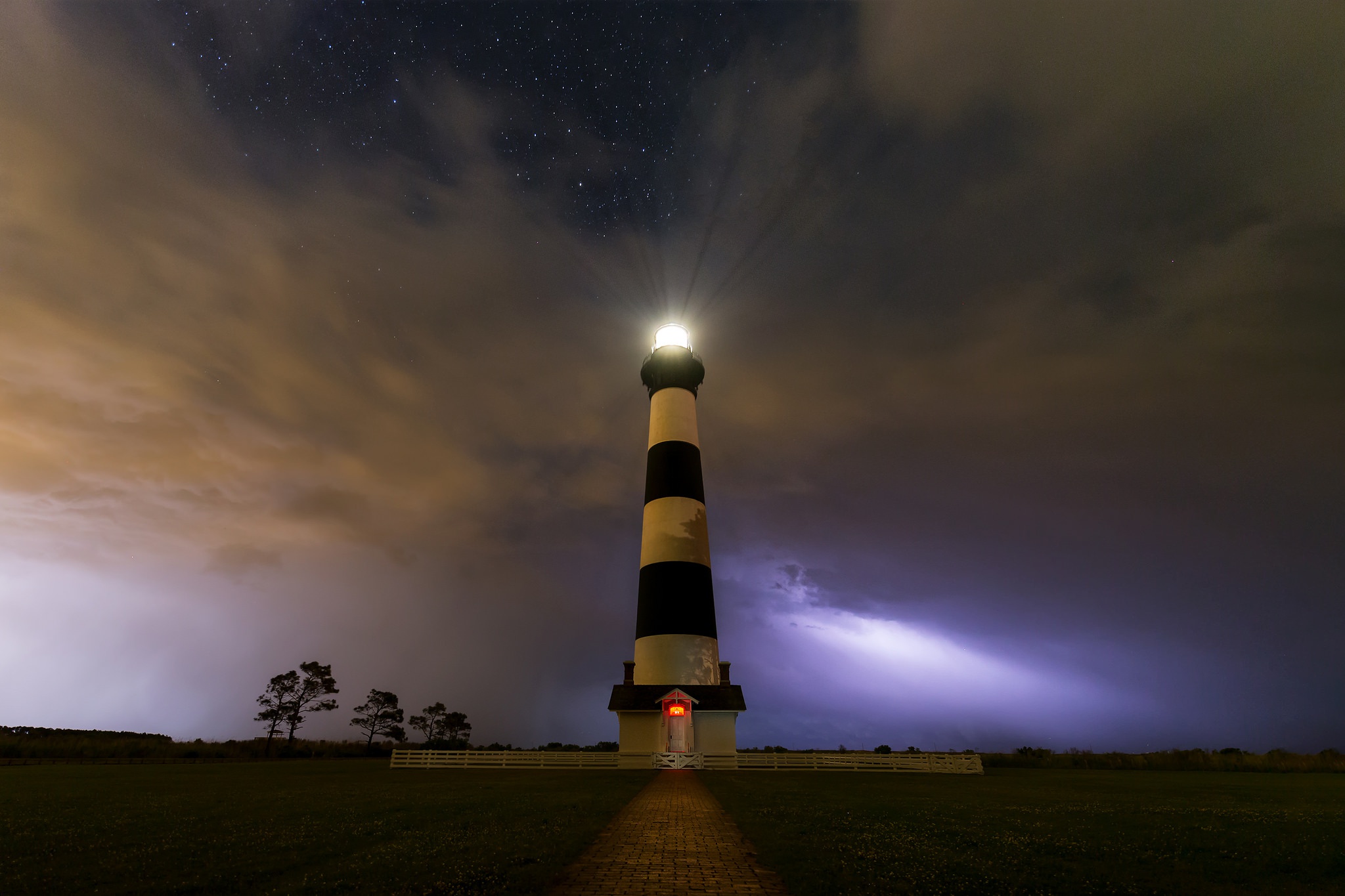 Download mobile wallpaper Sky, Night, Building, Lighthouse, Cloud, Man Made for free.