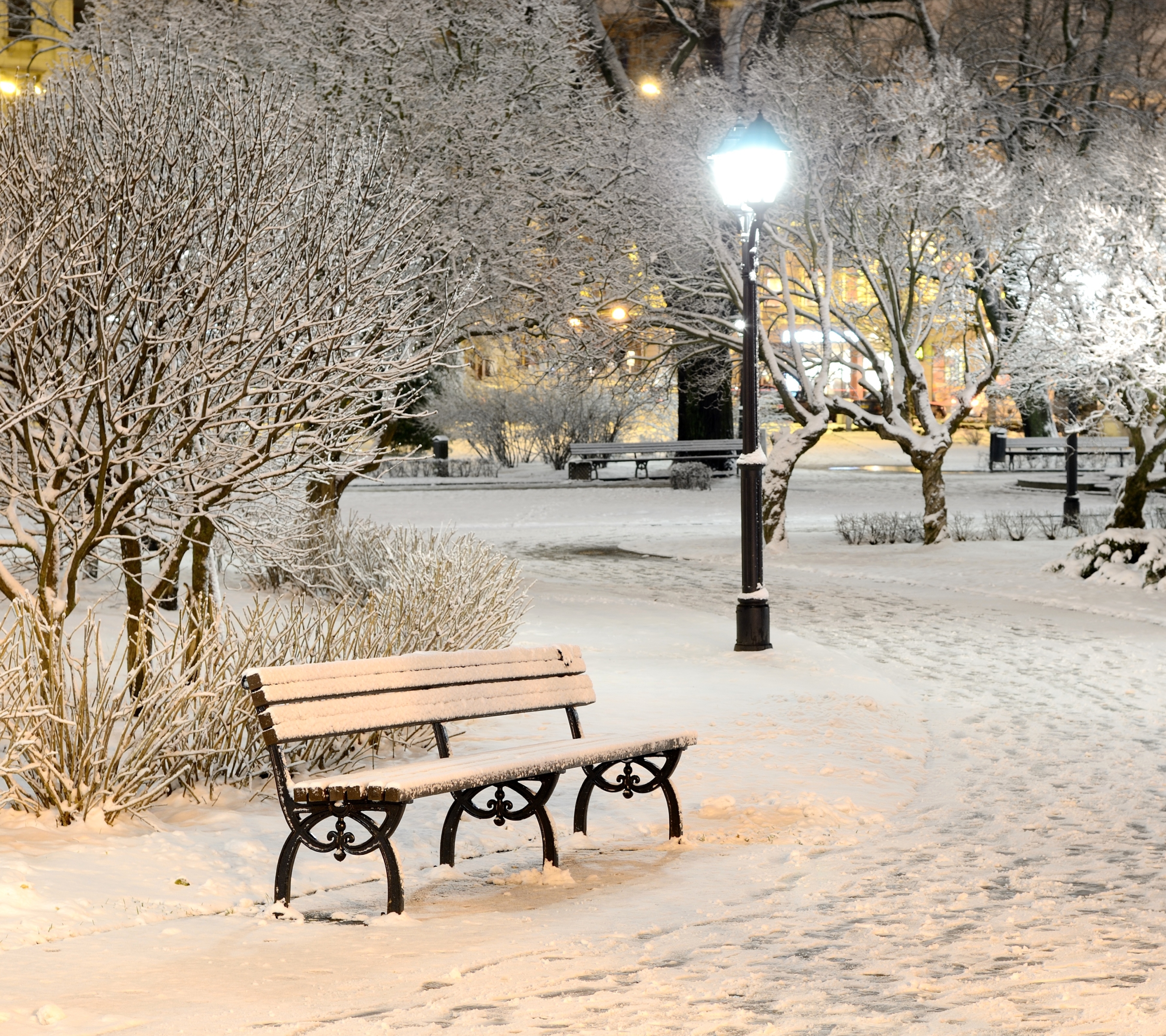Download mobile wallpaper Winter, Snow, Light, Park, Tree, Bench, Man Made for free.