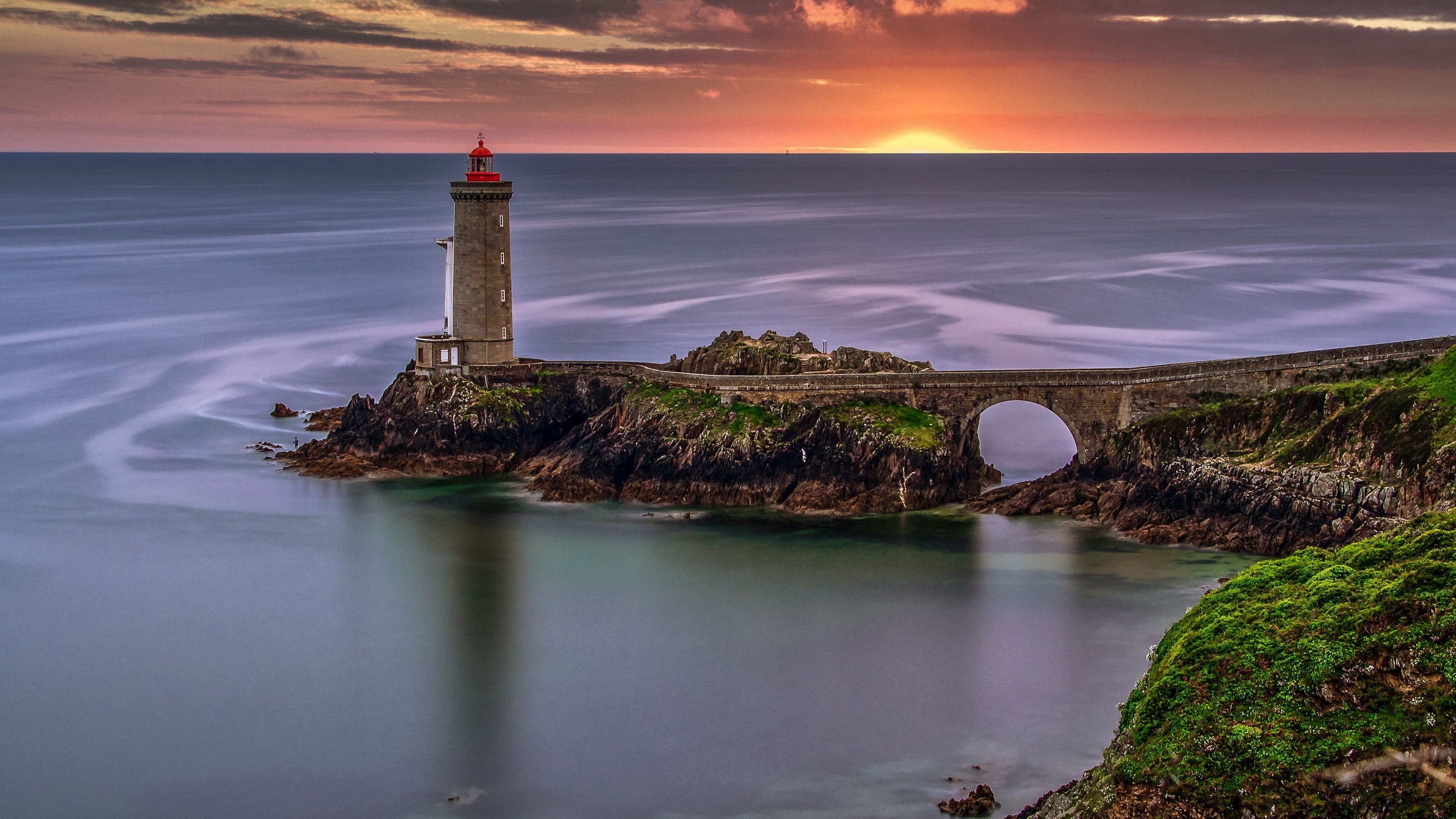 Download mobile wallpaper Sunset, Sea, France, Lighthouse, Man Made for free.