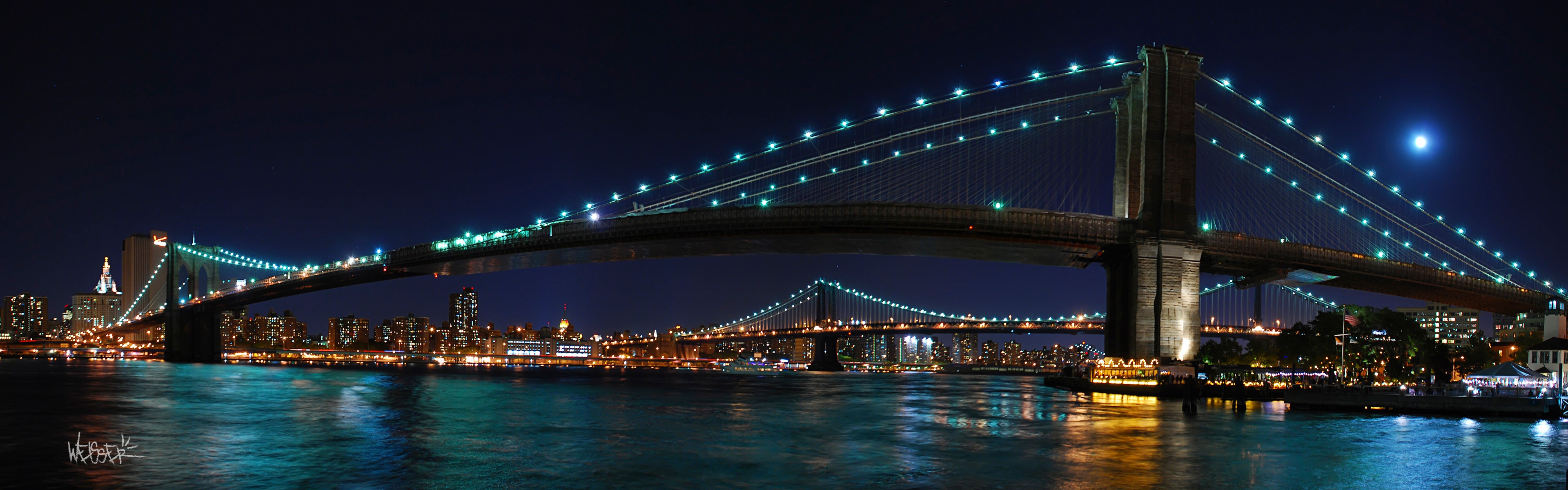 Скачать картинку Мосты, Море, Ночь, Свет, Океан, Синий, Мост, Городской Пейзаж, Нью Йорк, Бруклинский Мост, Сделано Человеком в телефон бесплатно.