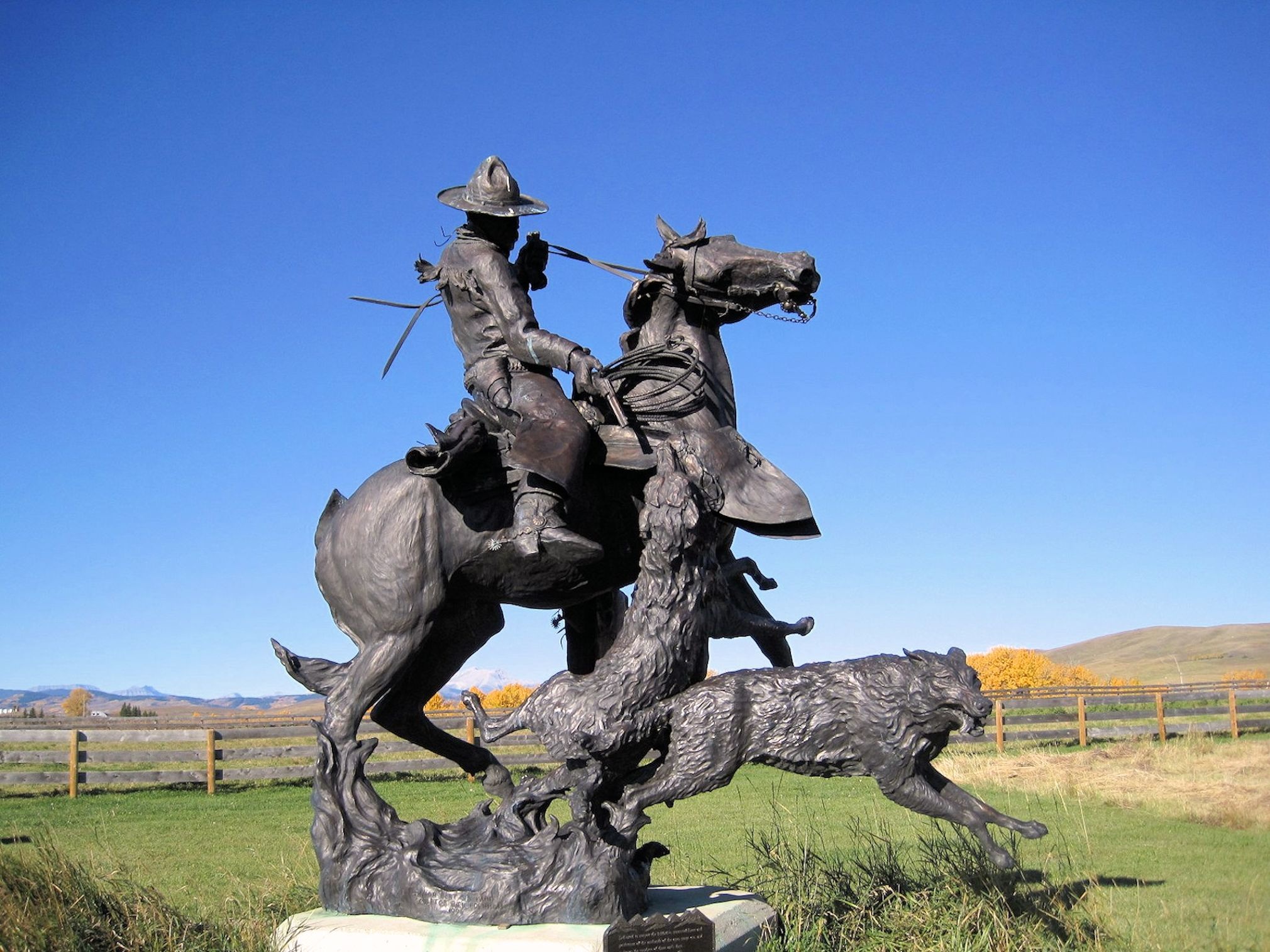 Download mobile wallpaper Wolf, Statue, Sculpture, Horse, Alberta, Cowboy, Man Made for free.
