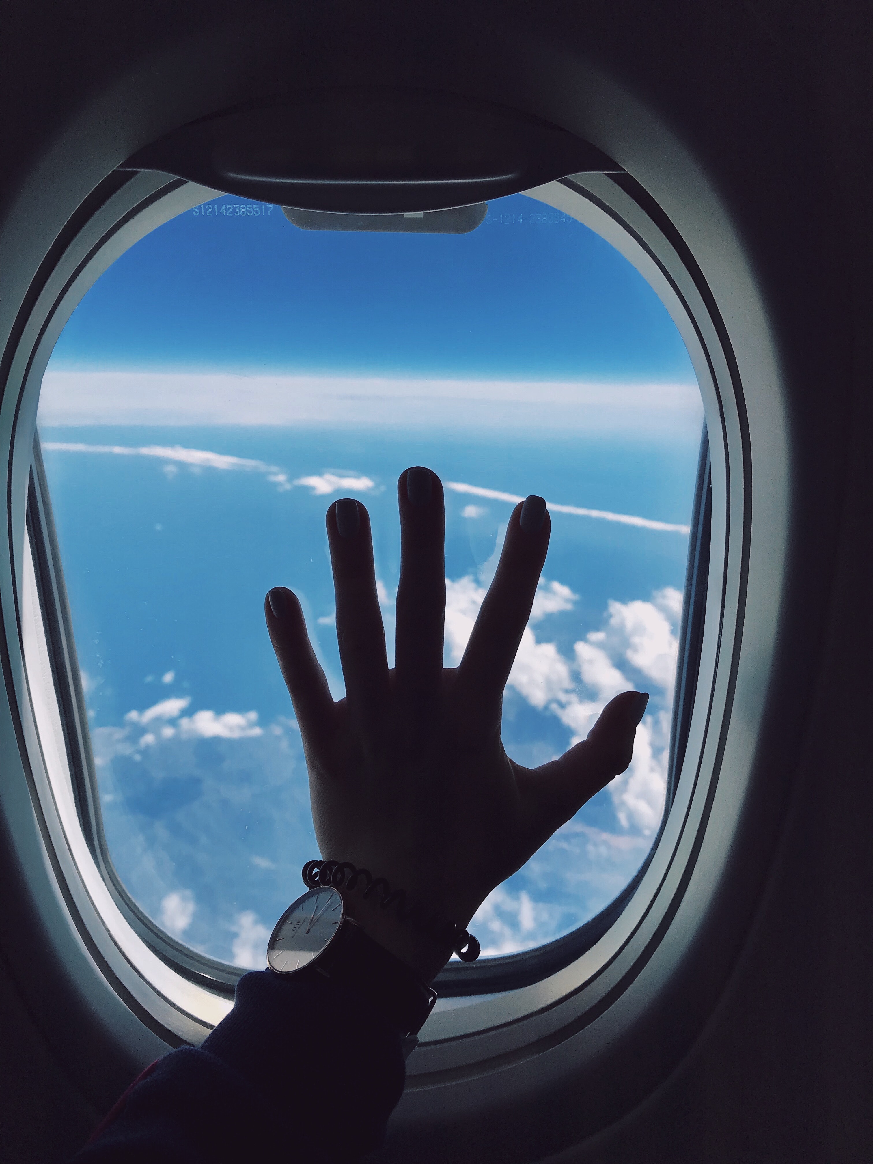 Download mobile wallpaper Clouds, Window, Porthole, Miscellanea, Miscellaneous, Hand, Airplane, Plane for free.