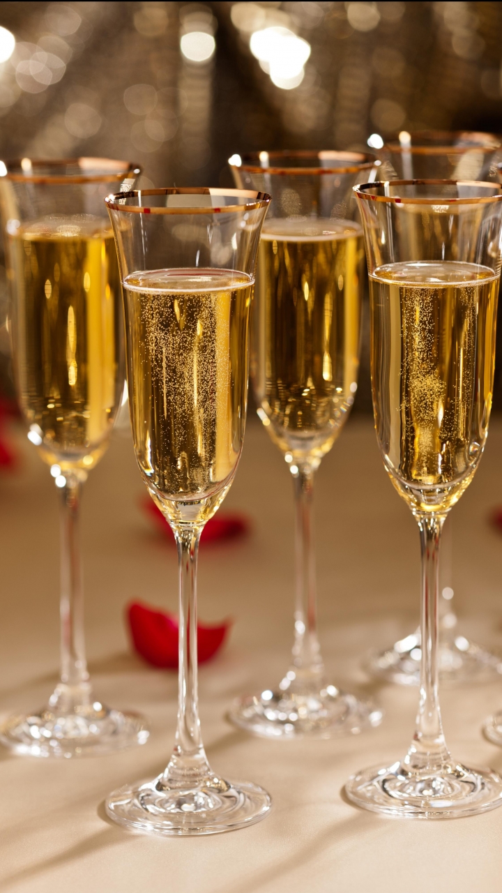Download mobile wallpaper Food, New Year, Glass, Candle, Petal, Champagne for free.