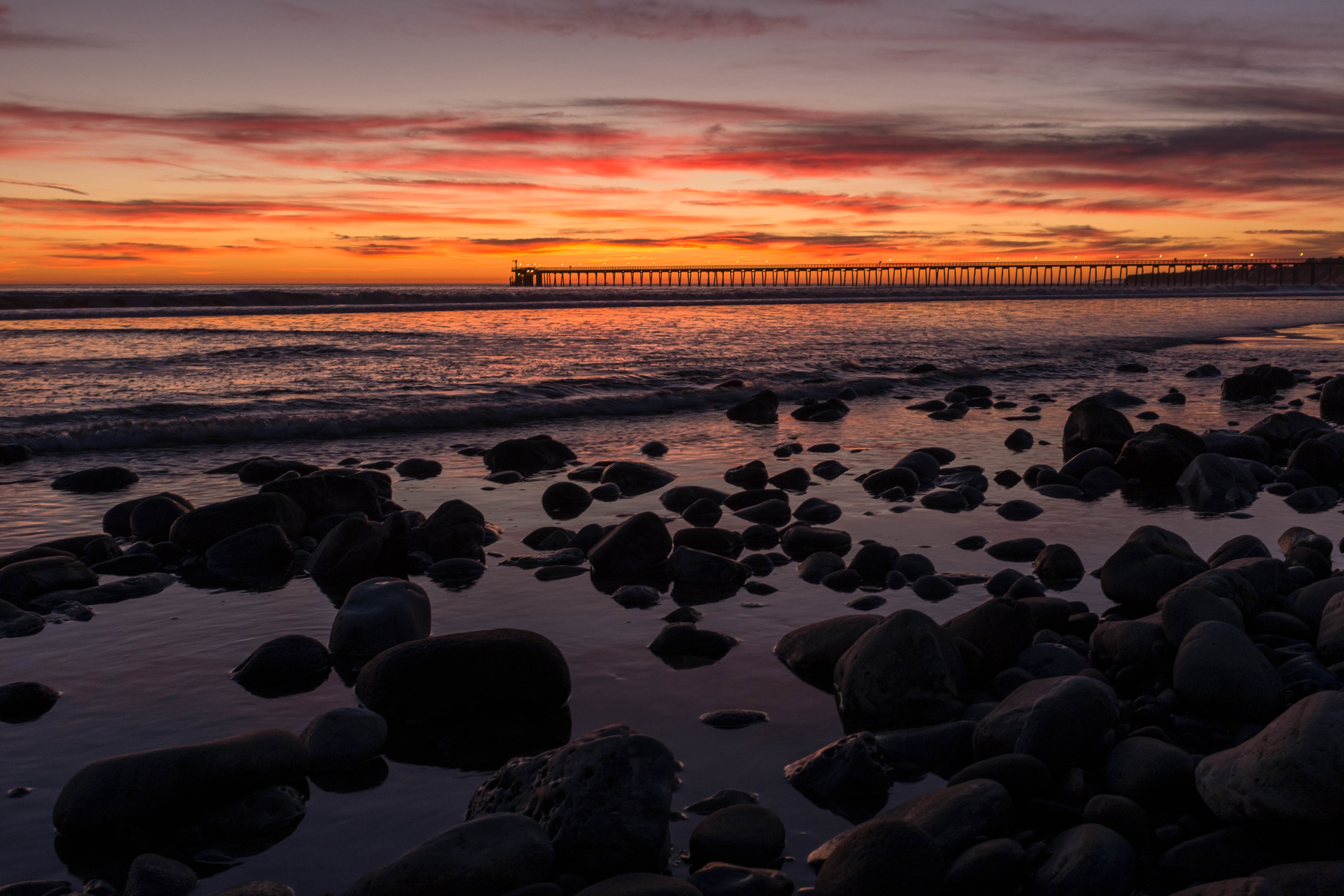 Free download wallpaper Sunset, Stones, Horizon, Bridge, Nature, Sea on your PC desktop