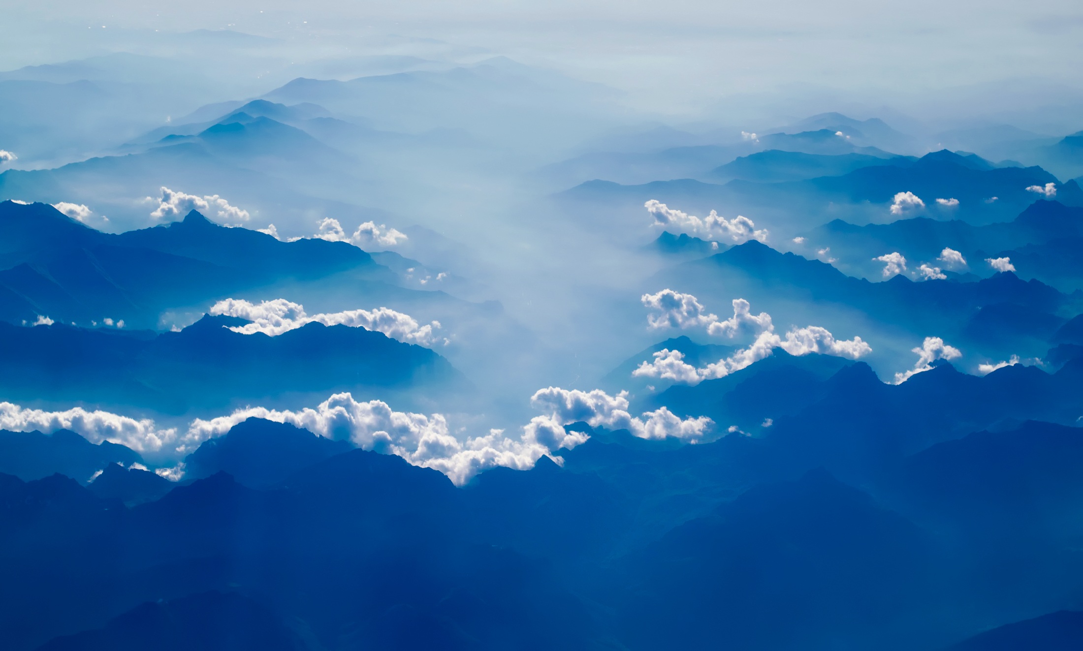 Download mobile wallpaper Nature, Mountains, Mountain, Peak, Fog, Earth, Cloud, Aerial for free.