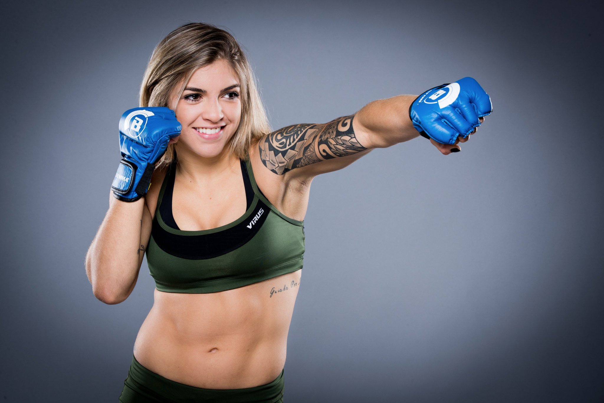 Download mobile wallpaper Sports, Smile, Tattoo, Blonde, Mixed Martial Arts, Brown Eyes for free.