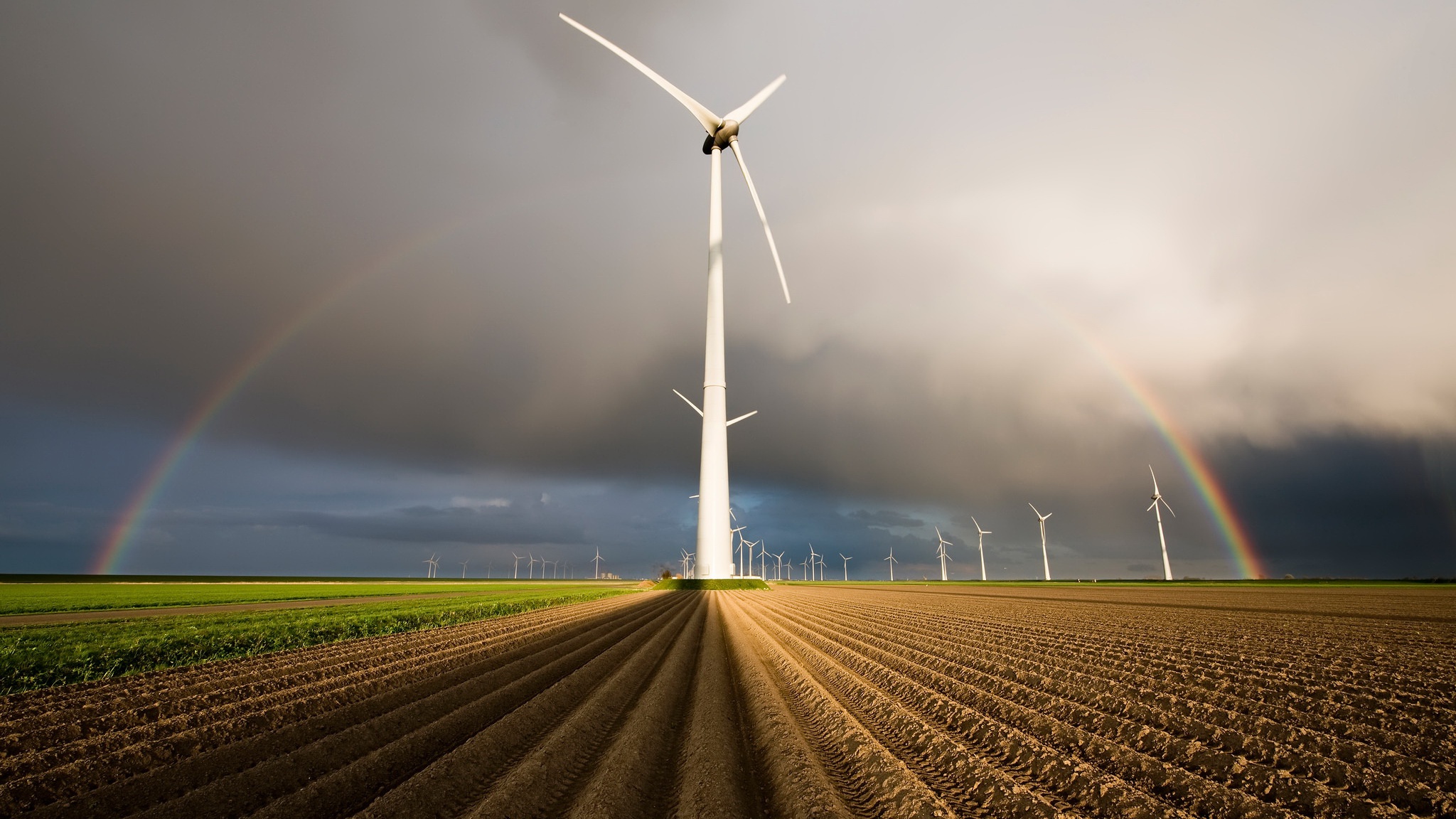 Download mobile wallpaper Rainbow, Field, Wind Turbine, Man Made for free.