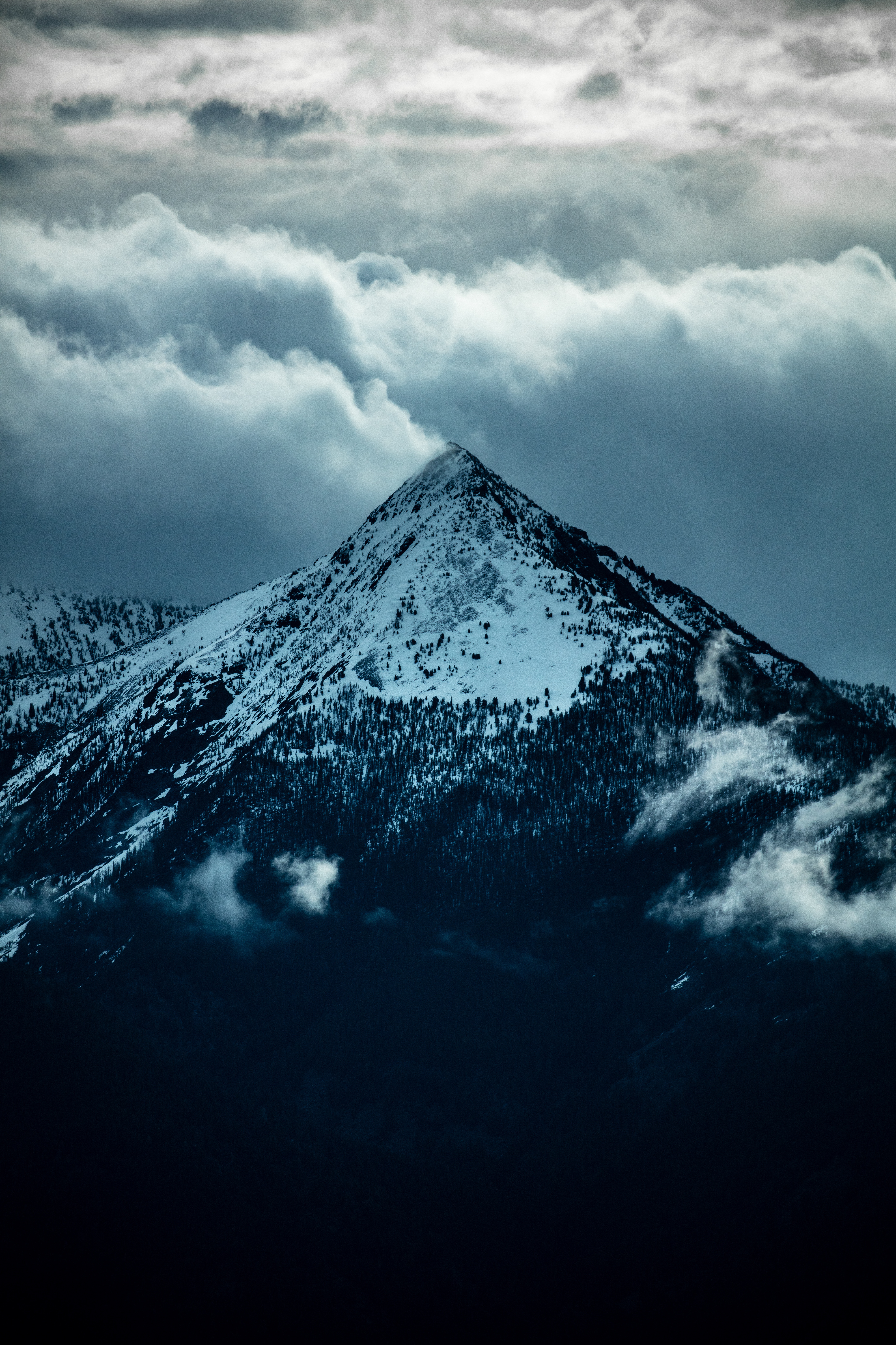 Download mobile wallpaper Clouds, Slope, Top, Vertex, Snow, Trees, Mountain, Nature for free.